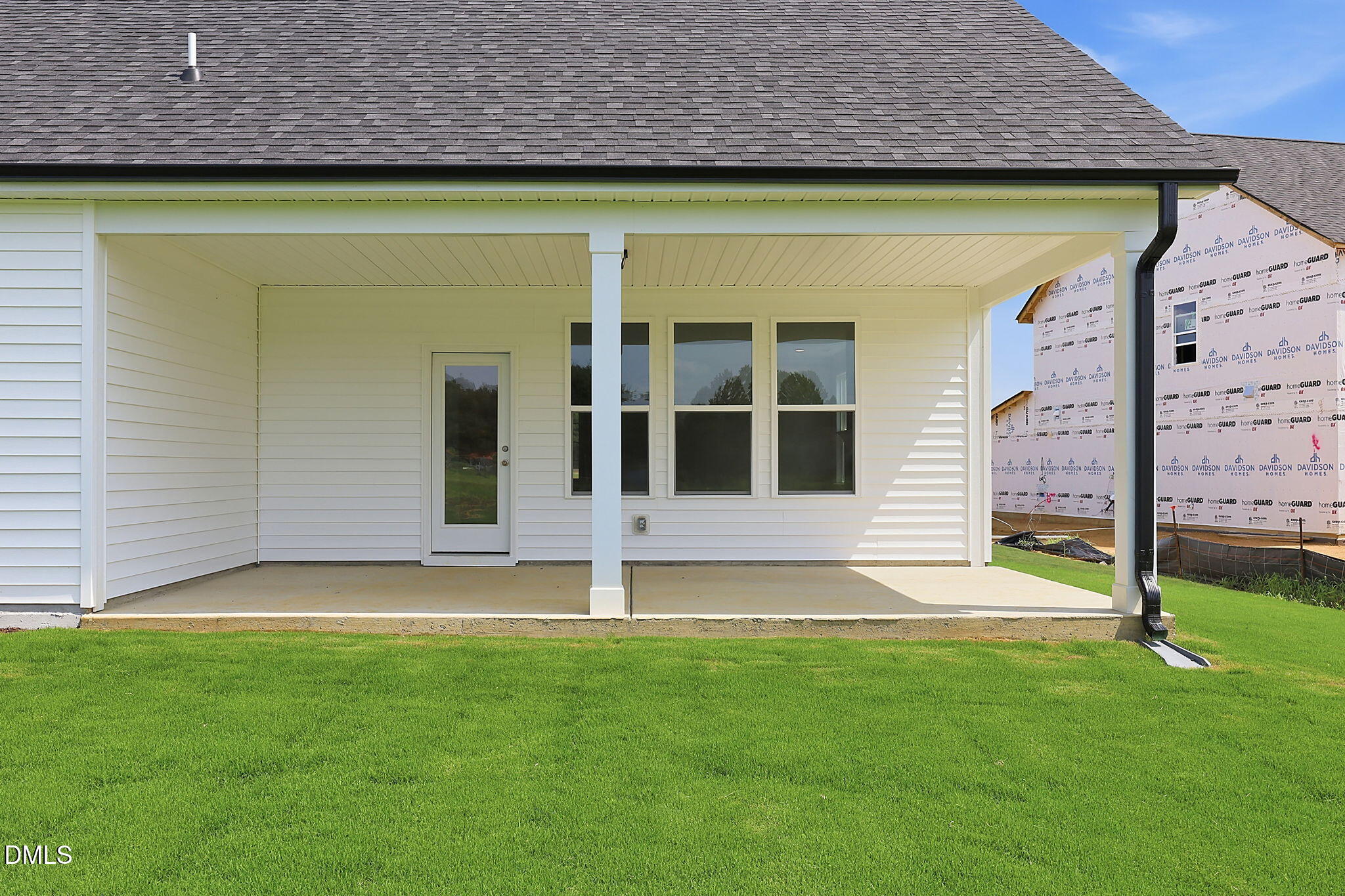 Covered back patio of The Magnolia B floor plan by Davidson Homes in Retreat at North Main, Lillington, North Carolina.