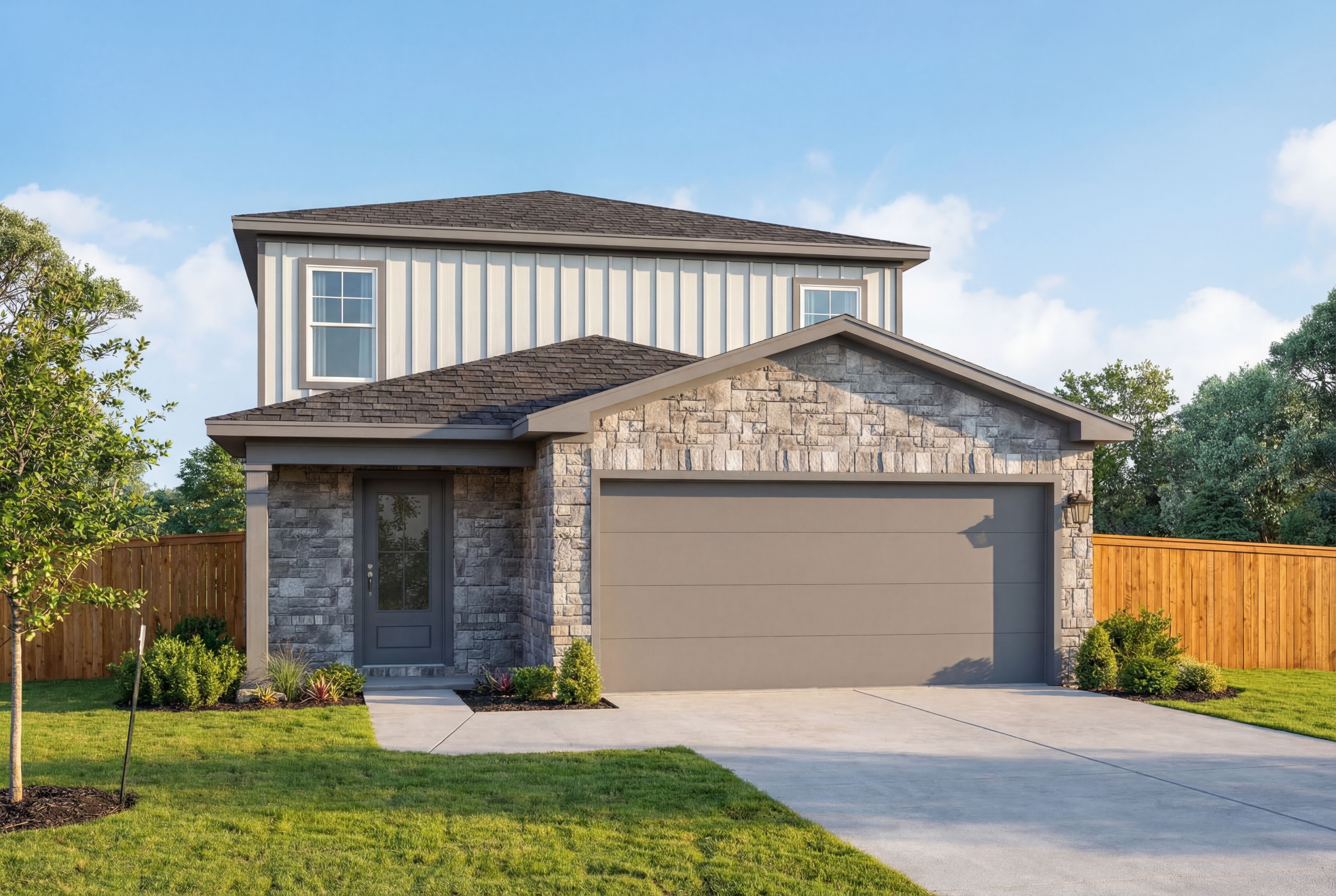 Two-story San Marcos home elevation by Davidson Homes with stone facade, gray siding, two-car garage, and landscaped yard