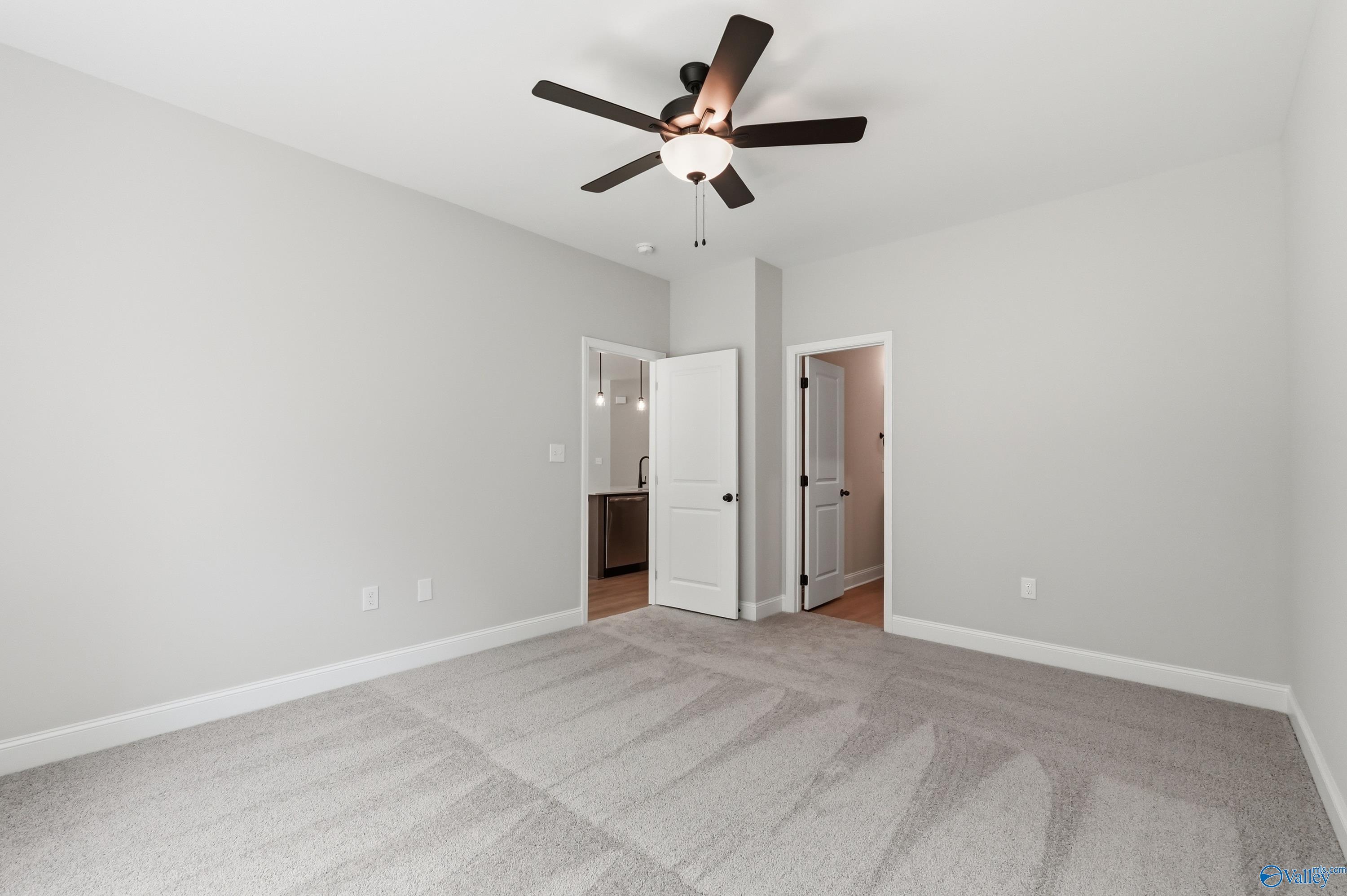 Master bedroom suite with ceiling fan, en-suite bath access, and closet in Davidson Homes The Franklin, Huntsville Alabama