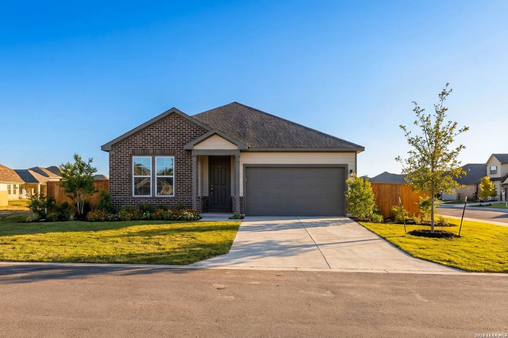 The Daphne H by Davidson Homes in Hannah Heights, Seguin, TX, featuring a 1-story brick exterior and 2-car garage.