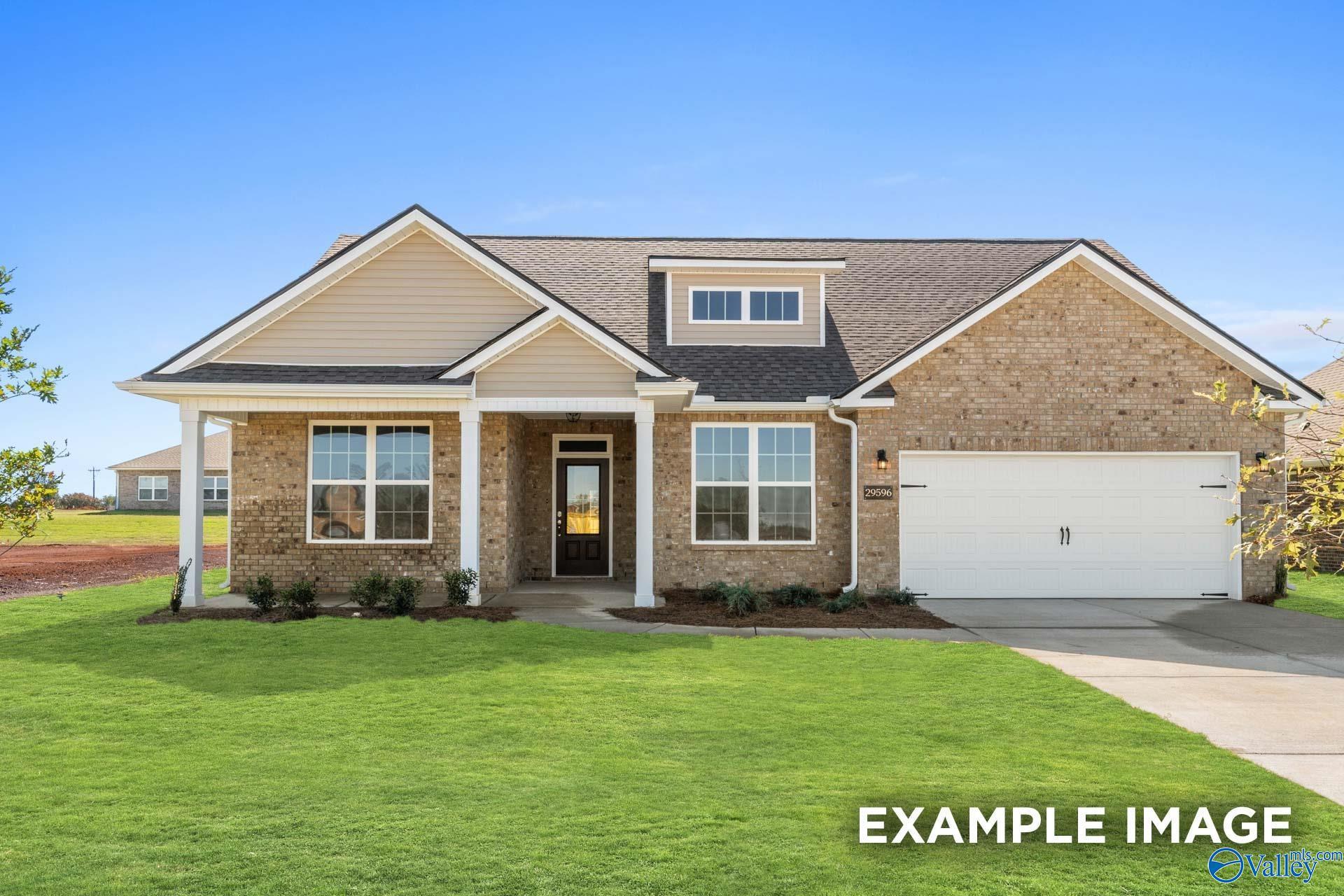 Modern brick ranch-style home with 2-car garage, covered porch, and lush lawn in Cain Park, Hartselle, Alabama by Davidson Homes