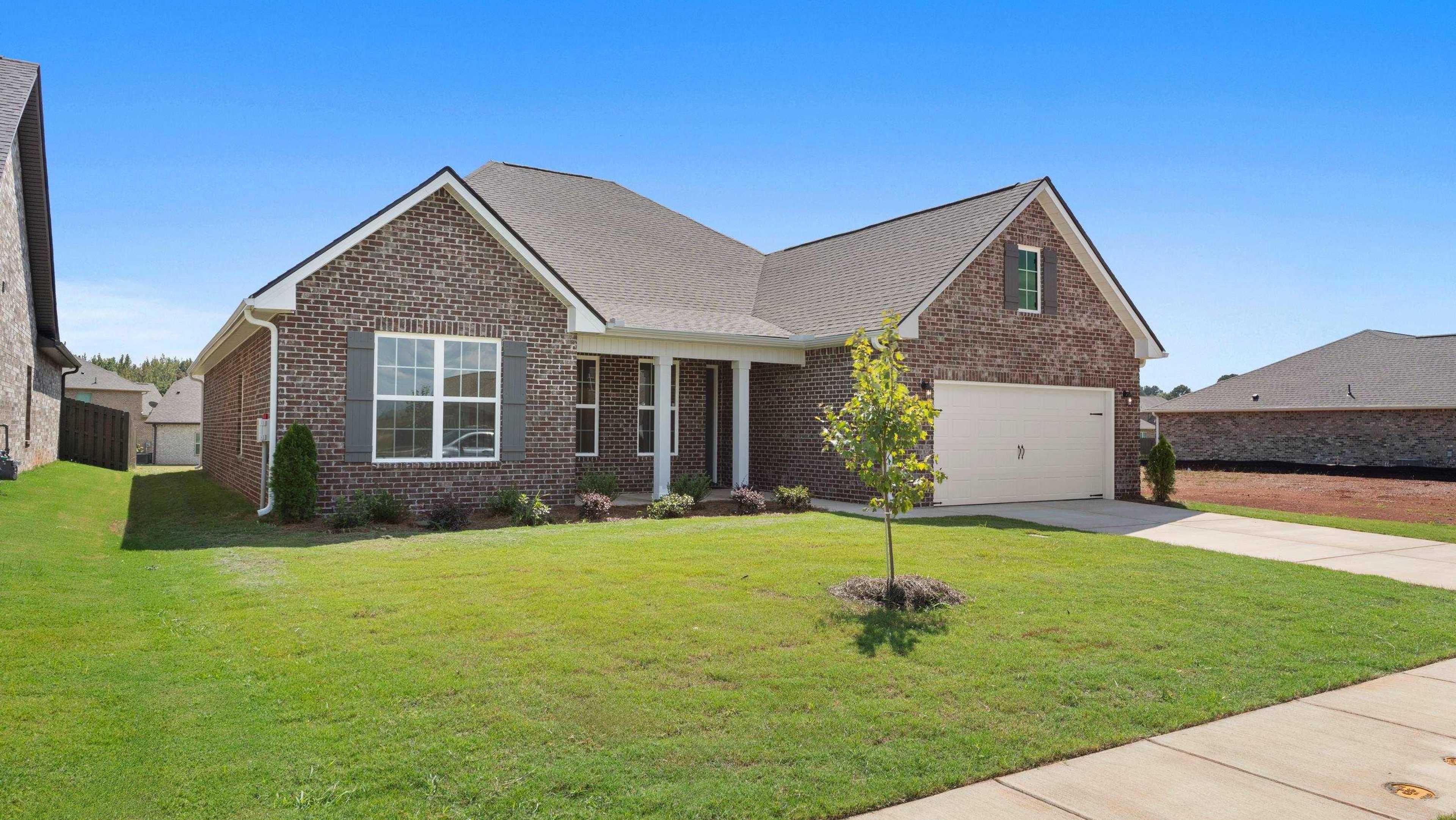 Brick single-story home at 236 White Horse Way open house, with garage, front porch, green lawn, shrubs, and blue sky