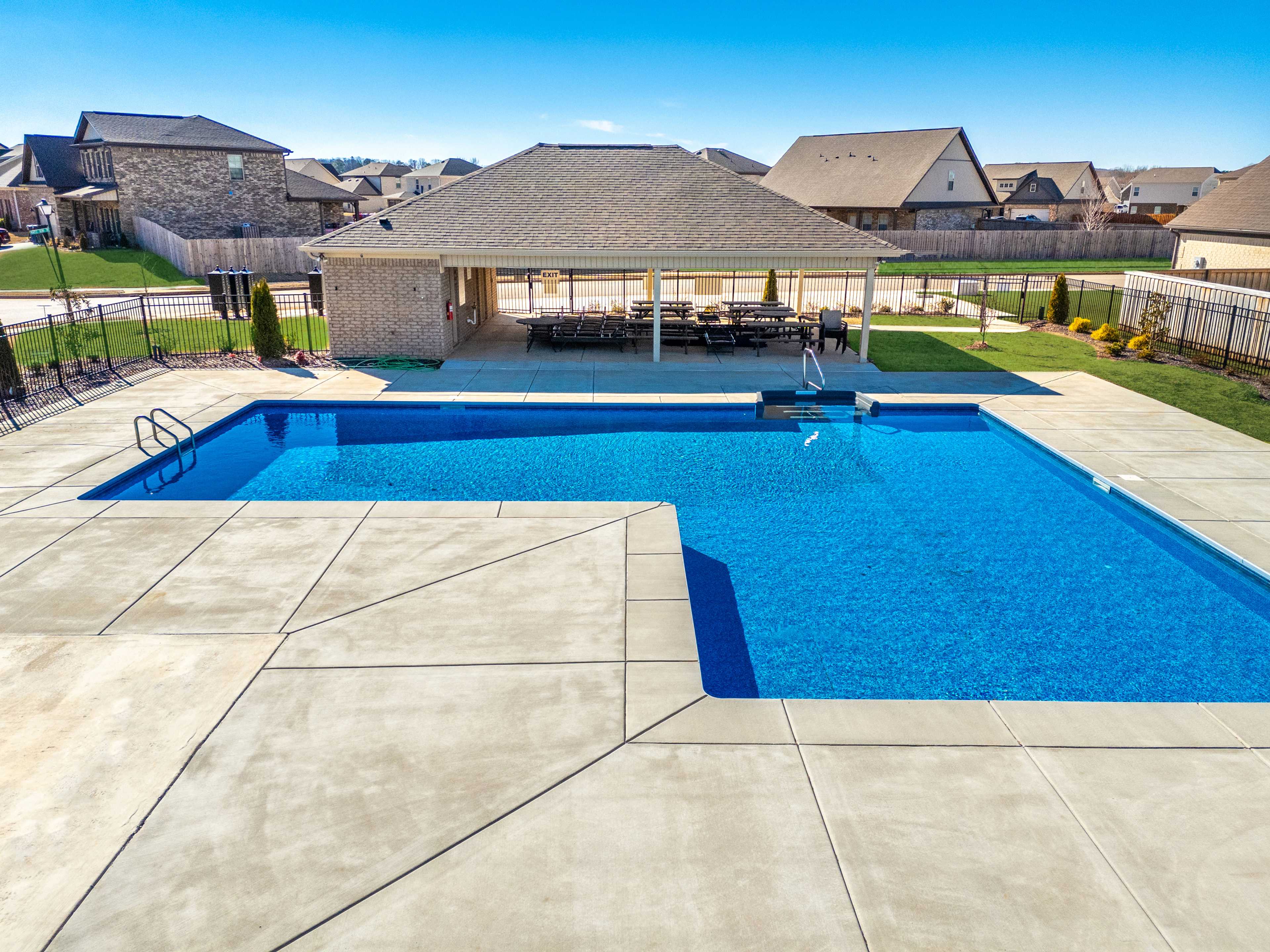 Resort-style community pool at Ivy Hills in Toney Alabama with covered pavilion and lounge seating