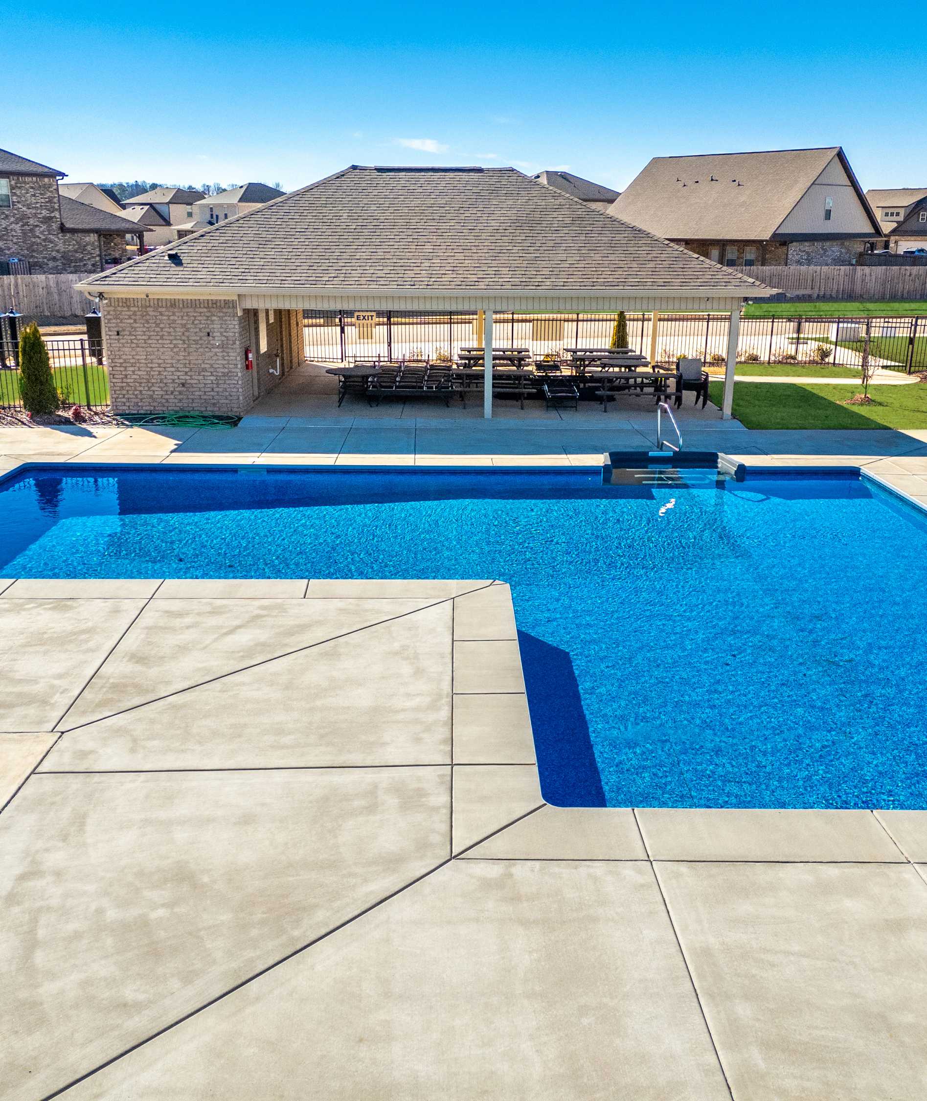 Resort-style community pool at Ivy Hills in Toney Alabama with covered pavilion and lounge seating