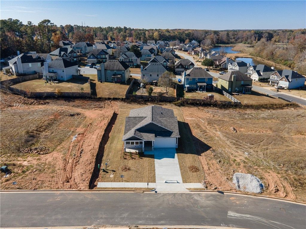 Aerial view of The Luna B 4-bedroom single-story home by Davidson Homes in Anderson Lakes, Opelika, Alabama, with 2-car garage and neighborhood surroundings