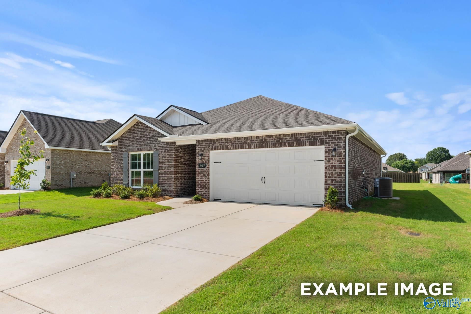 Modern brick single-story home with 2-car garage, concrete driveway, and manicured lawn in Blue Spring, Huntsville, Alabama - Davidson Homes The Asheville