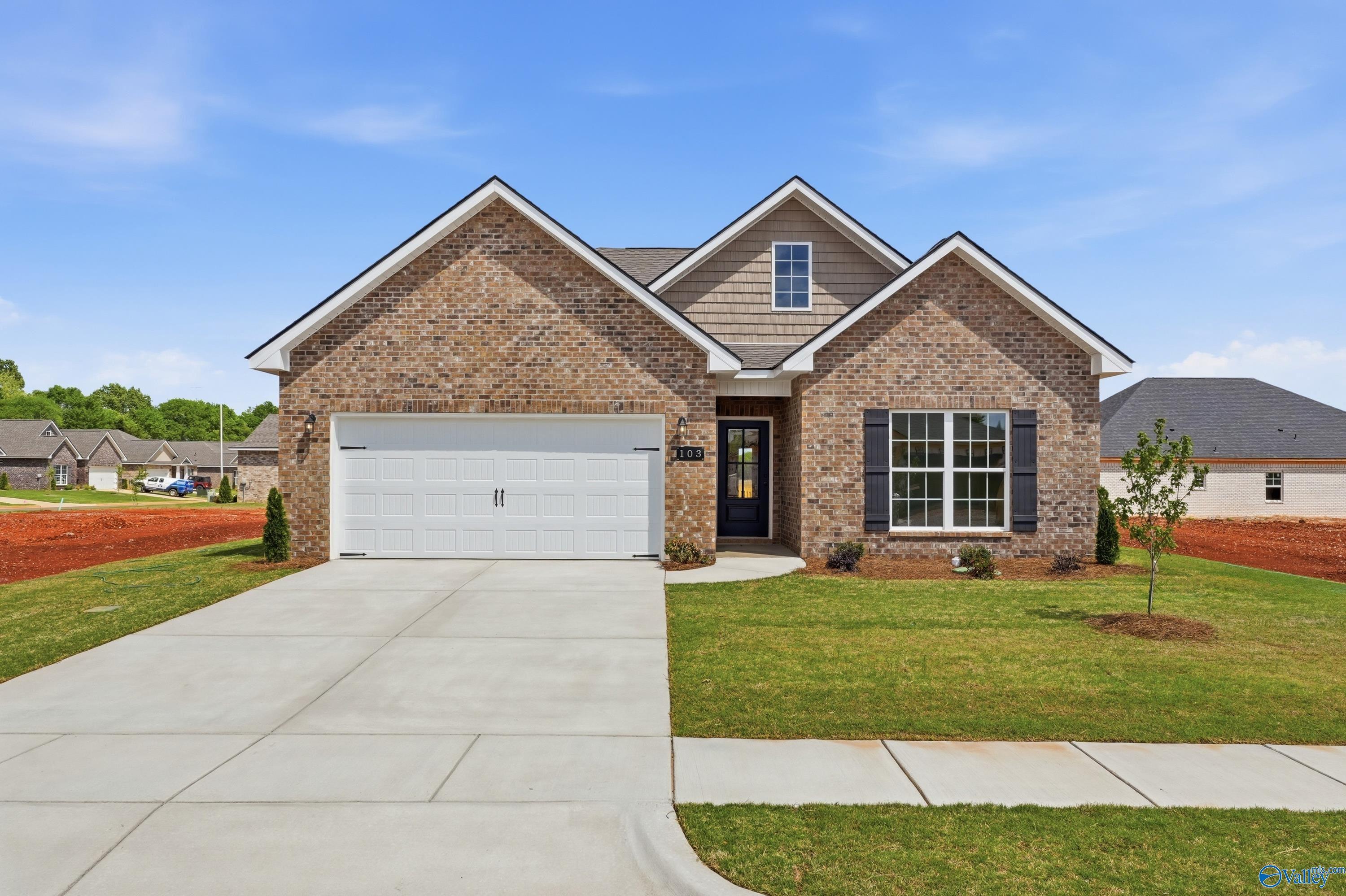 Modern brick ranch home with 2-car garage, gabled roof, and landscaped yard in Lynn Meadows, Meridianville, Alabama - Davidson Homes Franklin C