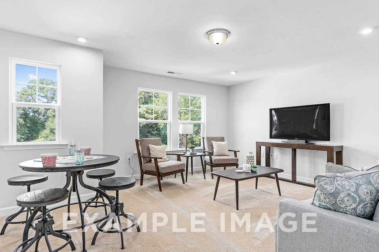 Davidson Homes The Chestnut Plan Loft with chairs, tables, and television