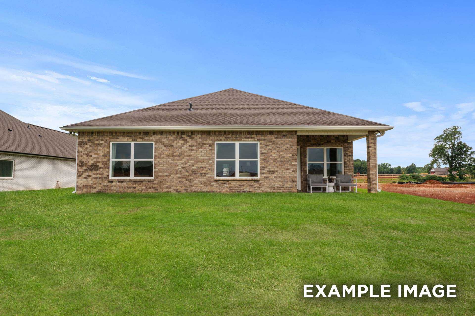 The Laurel N brick single-story home elevation with covered porch, large windows, and green lawn in Royse City, Texas