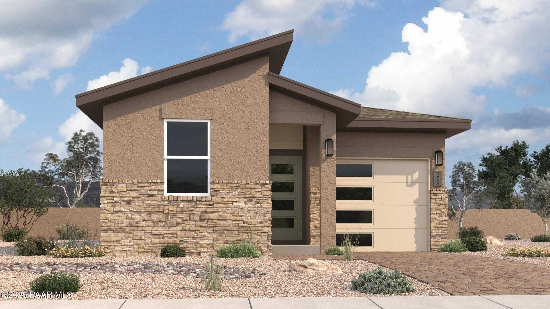 Modern beige stucco single-story home with sloped roof, 2-car garage, stone accents, and desert landscaping in Prescott, Arizona - Davidson Homes The Savannah C