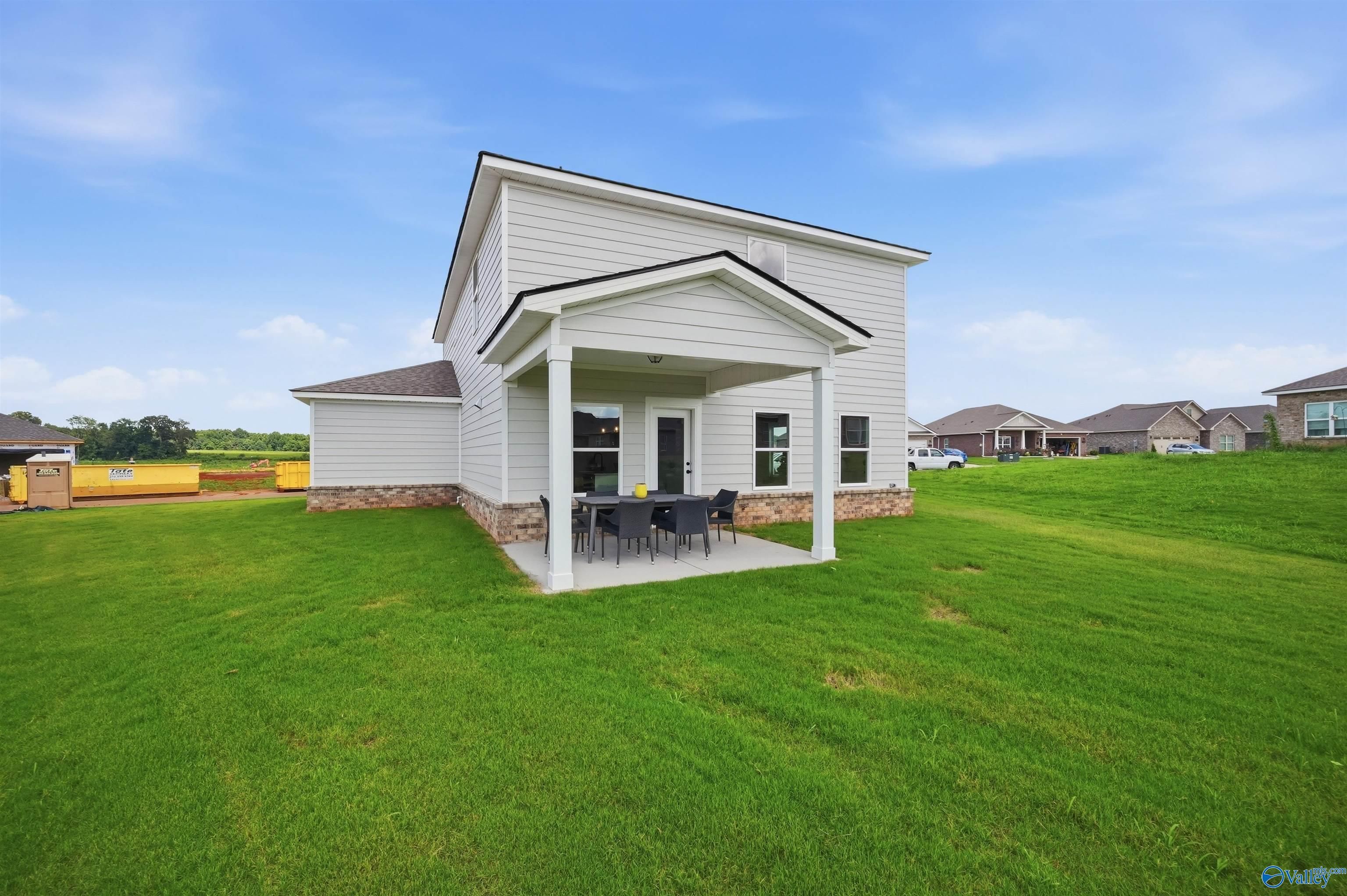 Covered patio of The Burton B floor plan by Davidson Homes in Heritage Lakes, New Market, Alabama.