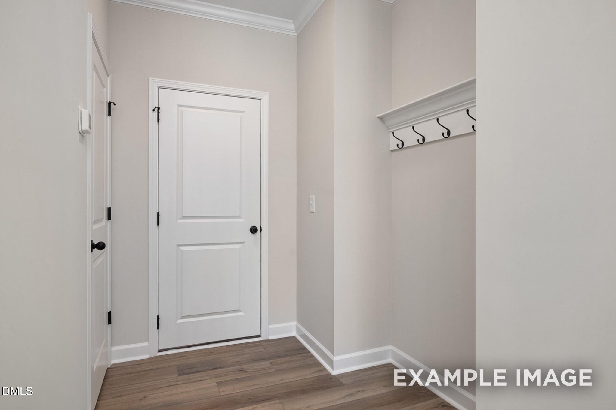 Mudroom area with wall-mounted coat hooks in The Mitchell floor plan at Camden Park, Knightdale, North Carolina.