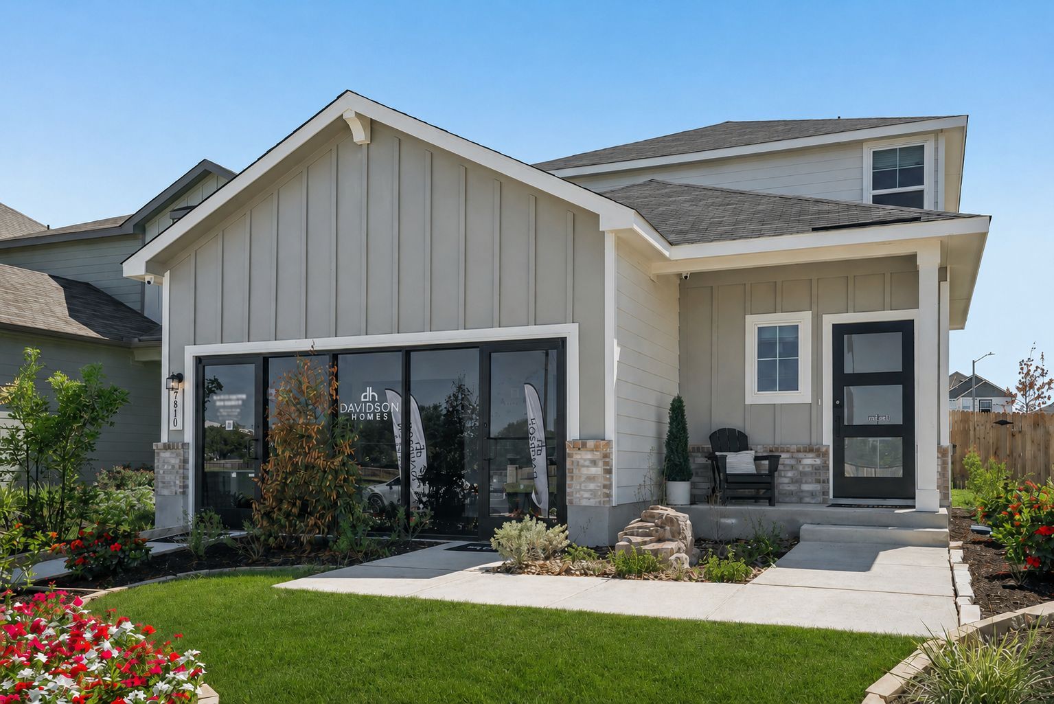 Davidson Homes sales office exterior at Fairway Crossing in Converse, Texas with modern farmhouse siding and landscaping.