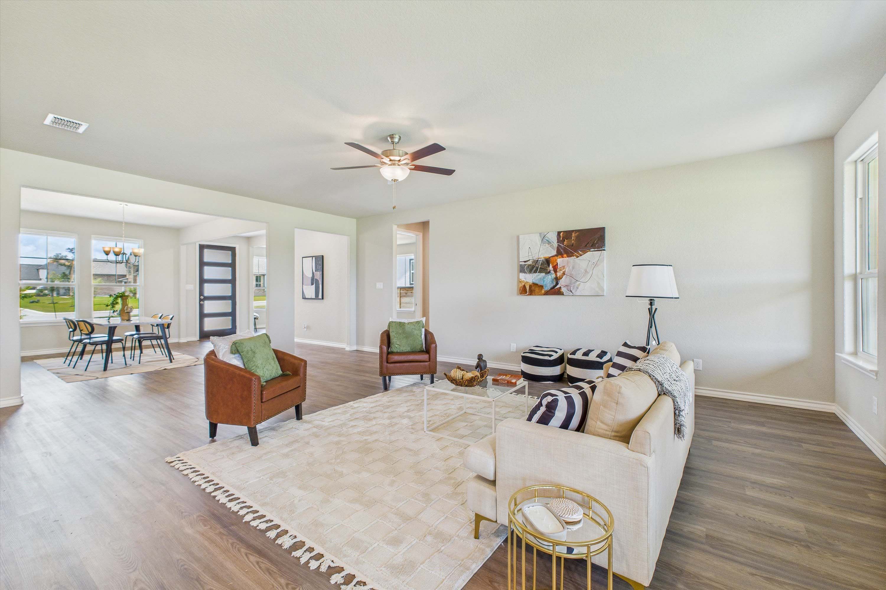 Open-concept living room in The Foster floor plan by Davidson Homes featuring modern decor and seamless dining area access.