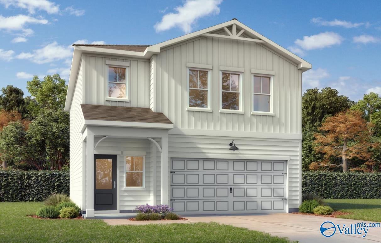 Two-story craftsman home exterior with white siding, 2-car garage, and covered front porch in Forest Glen, Hazel Green, Alabama