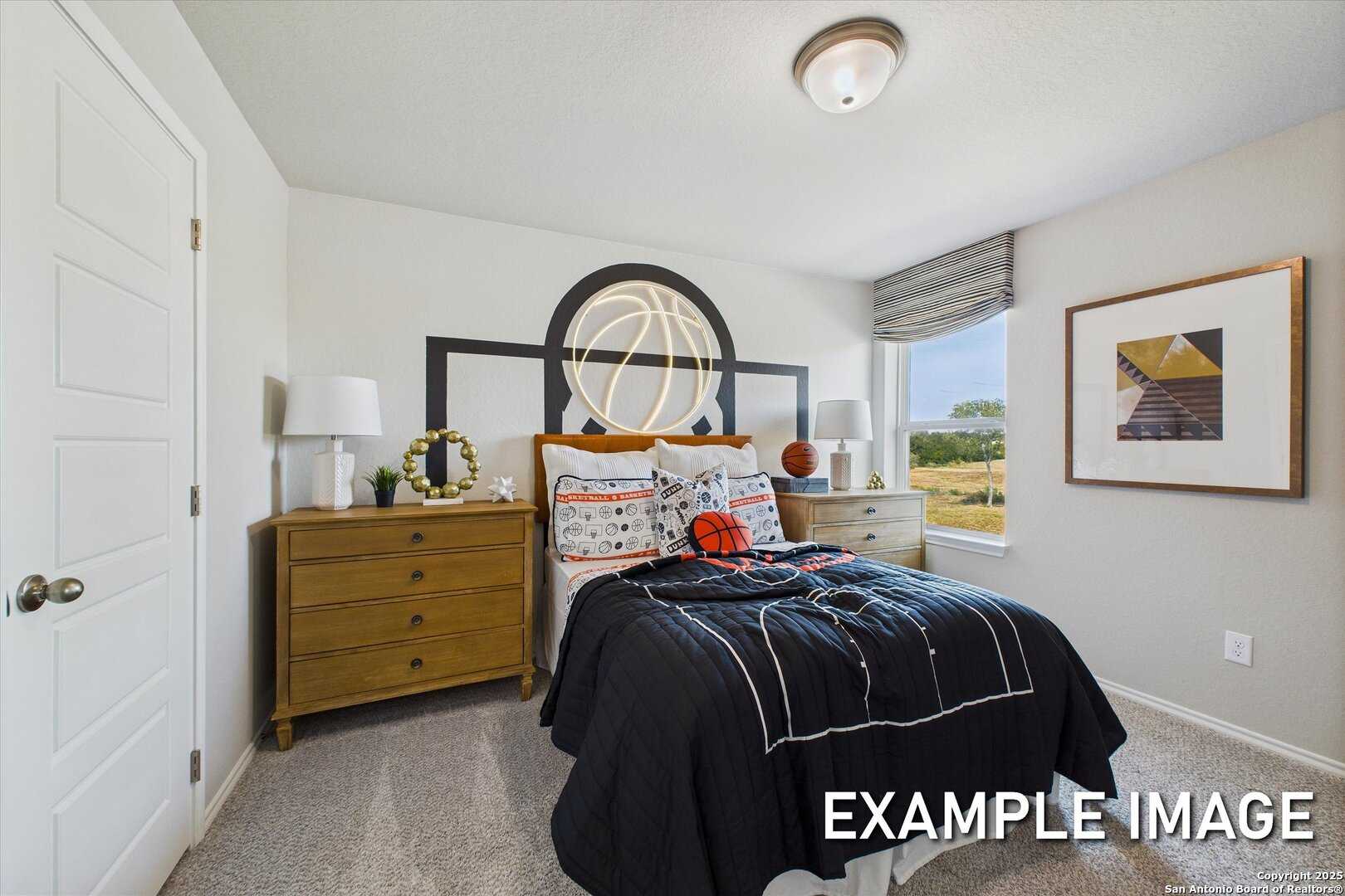Basketball-themed youth bedroom with neon hoop above bed, dresser, and window view in Davidson Homes The Sabine C, Agave, San Antonio
