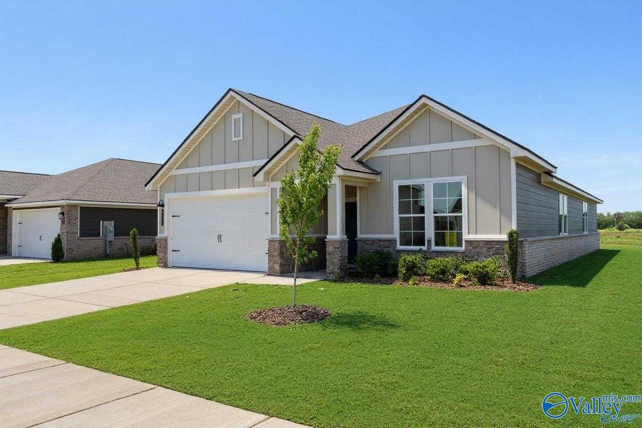 Modern 1-story Orion floor plan home with taupe siding, 2-car garage, and landscaped yard in Anderson Farm, Athens, Alabama