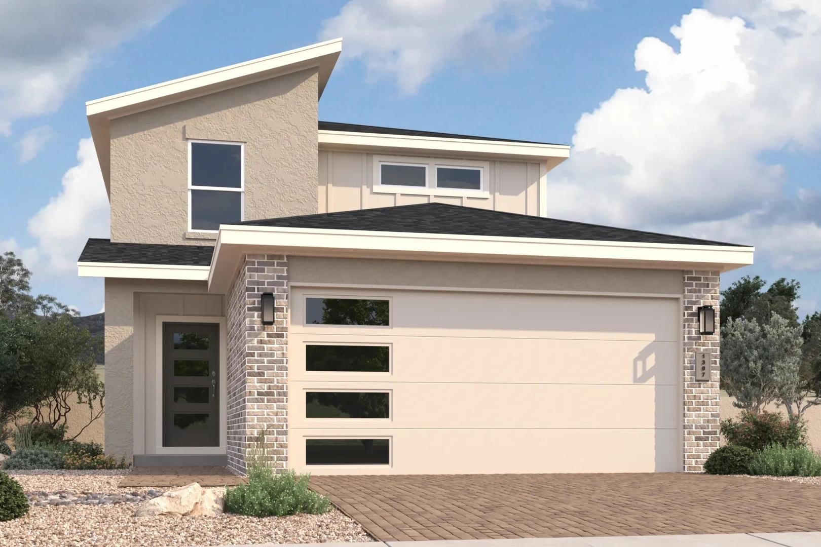 Modern two-story exterior of The Wilmington with beige siding, brick accents, large glass garage door, and desert landscaping in Prescott Arizona