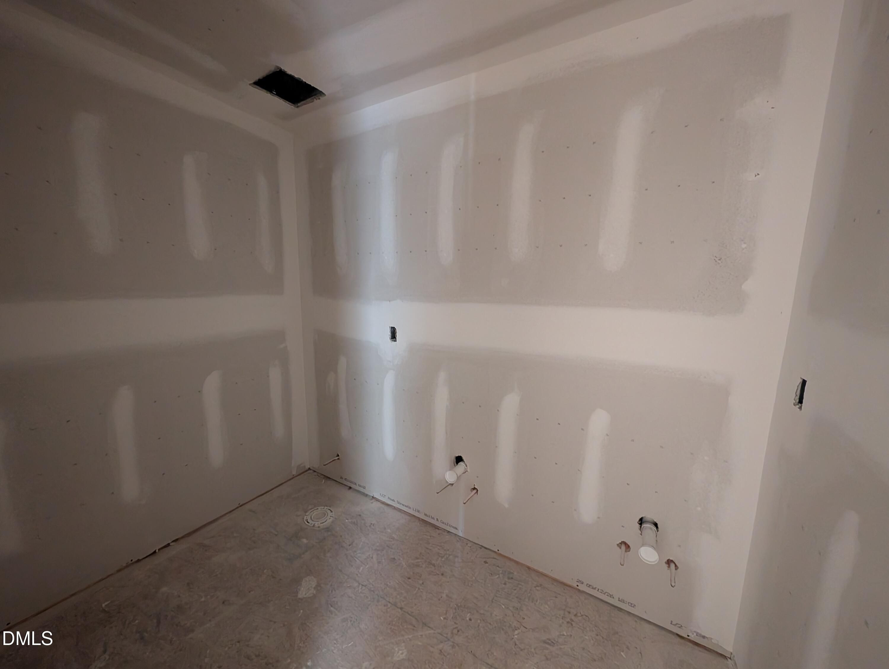 Unfinished bathroom with drywall and plumbing rough-ins in The Chestnut floor plan at Wendell Ridge, Wendell, NC.