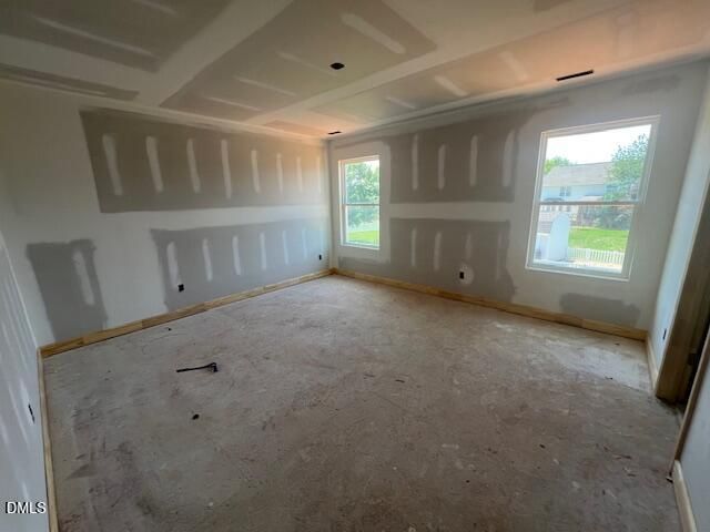 Spacious unfinished bedroom with drywall in The Gavin C floor plan at Gregory Village in Lillington, North Carolina.