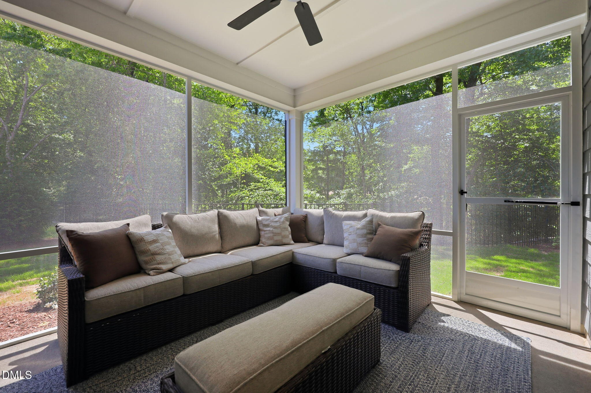 Screened-in porch with outdoor sectional seating at The Aspen B floor plan in Wendell Ridge, Wendell, North Carolina.