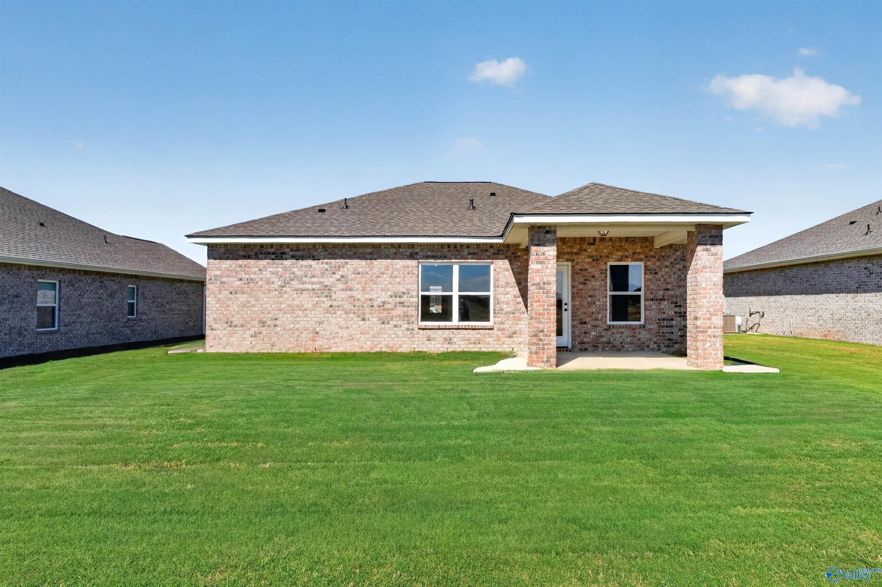 Brick single-story home with covered patio and spacious backyard in Clearview, Hazel Green, Alabama by Davidson Homes