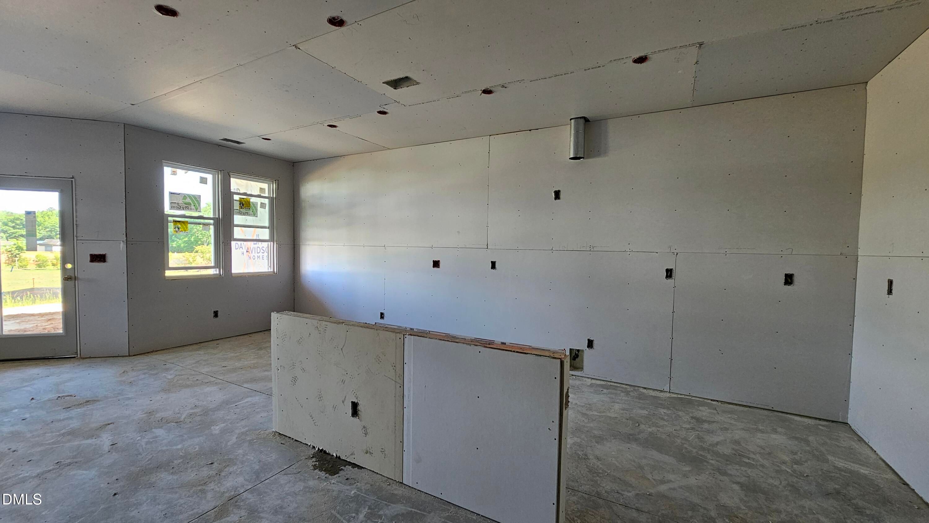 Unfinished open-concept kitchen area in The Graham Interior floor plan at Springvale, Fuquay-Varina, North Carolina.