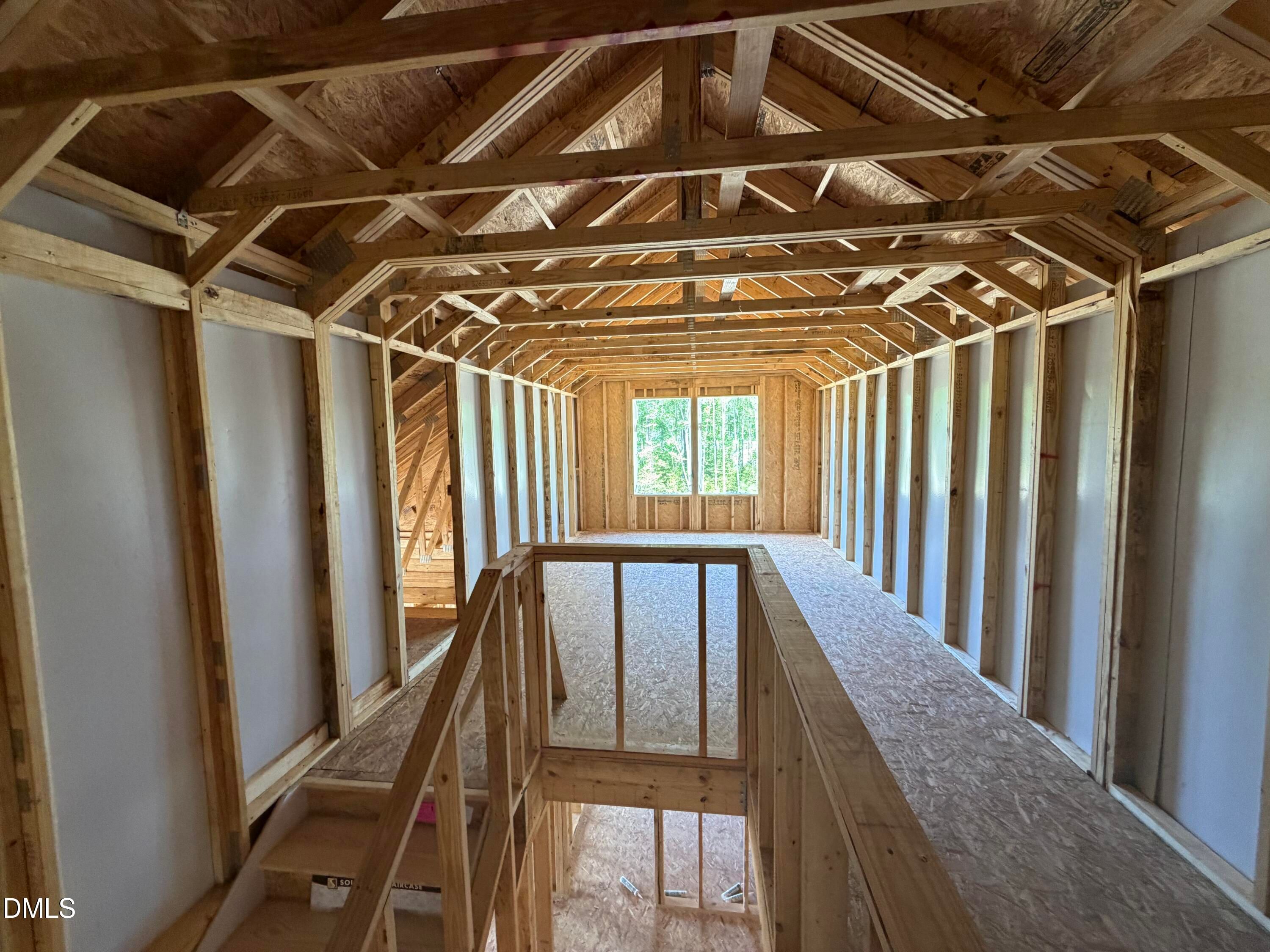Exposed wooden beams and vaulted ceiling in framed great room of Hickory II C home, Wellers Knoll, Lillington, NC