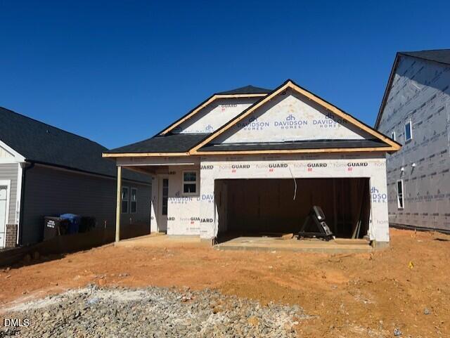 New Davidson Homes Carter C under construction with 2-car garage, front porch in Gregory Village, Lillington, NC