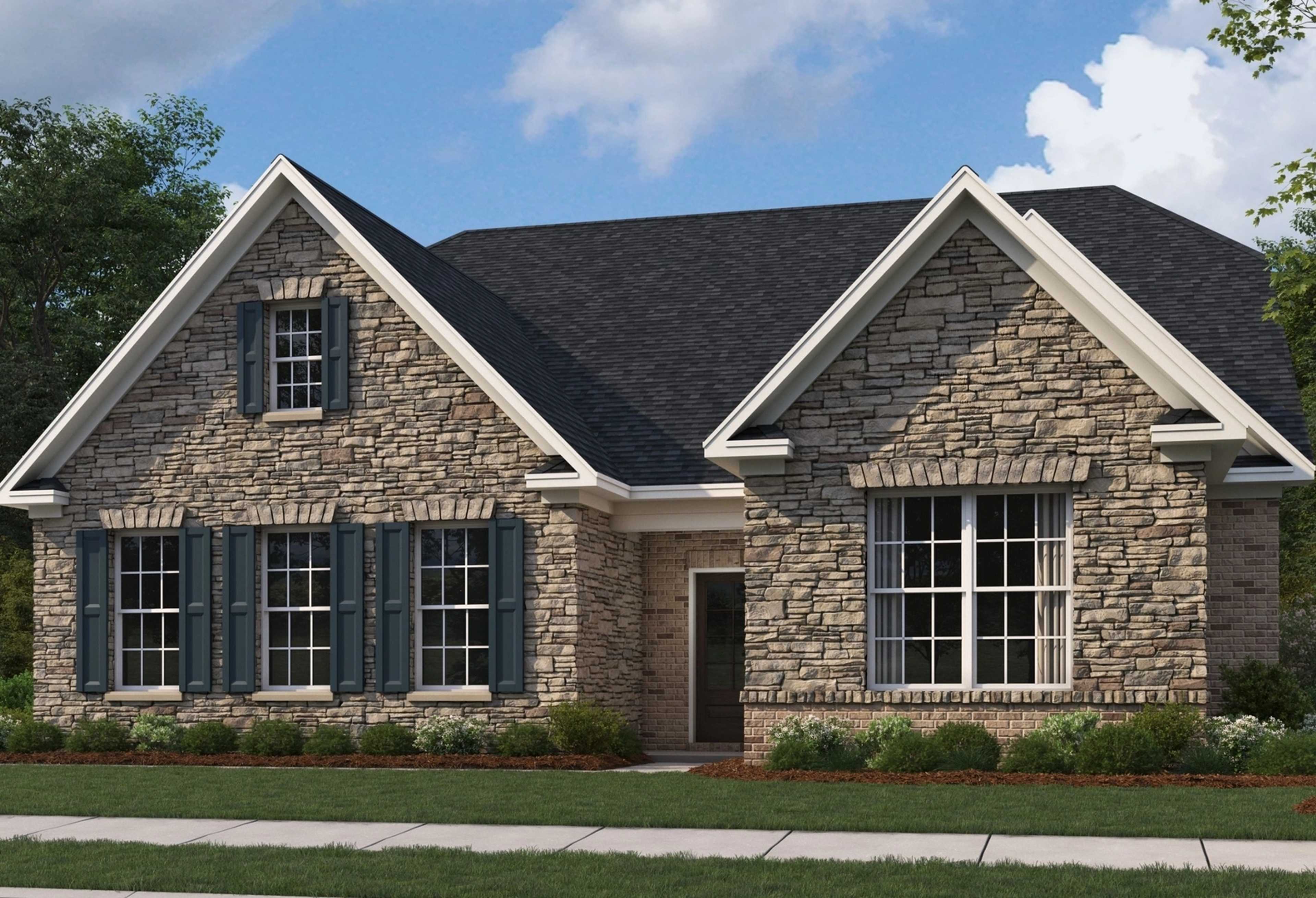 Stone exterior elevation of The Oxford 2-story home by Evermore Homes featuring gabled roof, shutters, and landscaped yard
