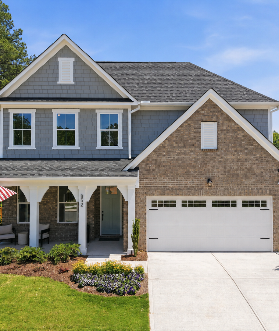 Two-story single-family home exterior by Davidson Homes at Sage on North Main in Wake Forest, NC with a two-car garage.