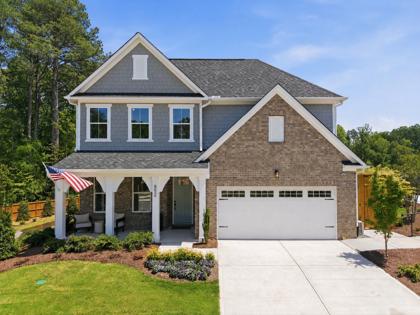 Two-story single-family home exterior by Davidson Homes at Sage on North Main in Wake Forest, NC with a two-car garage.