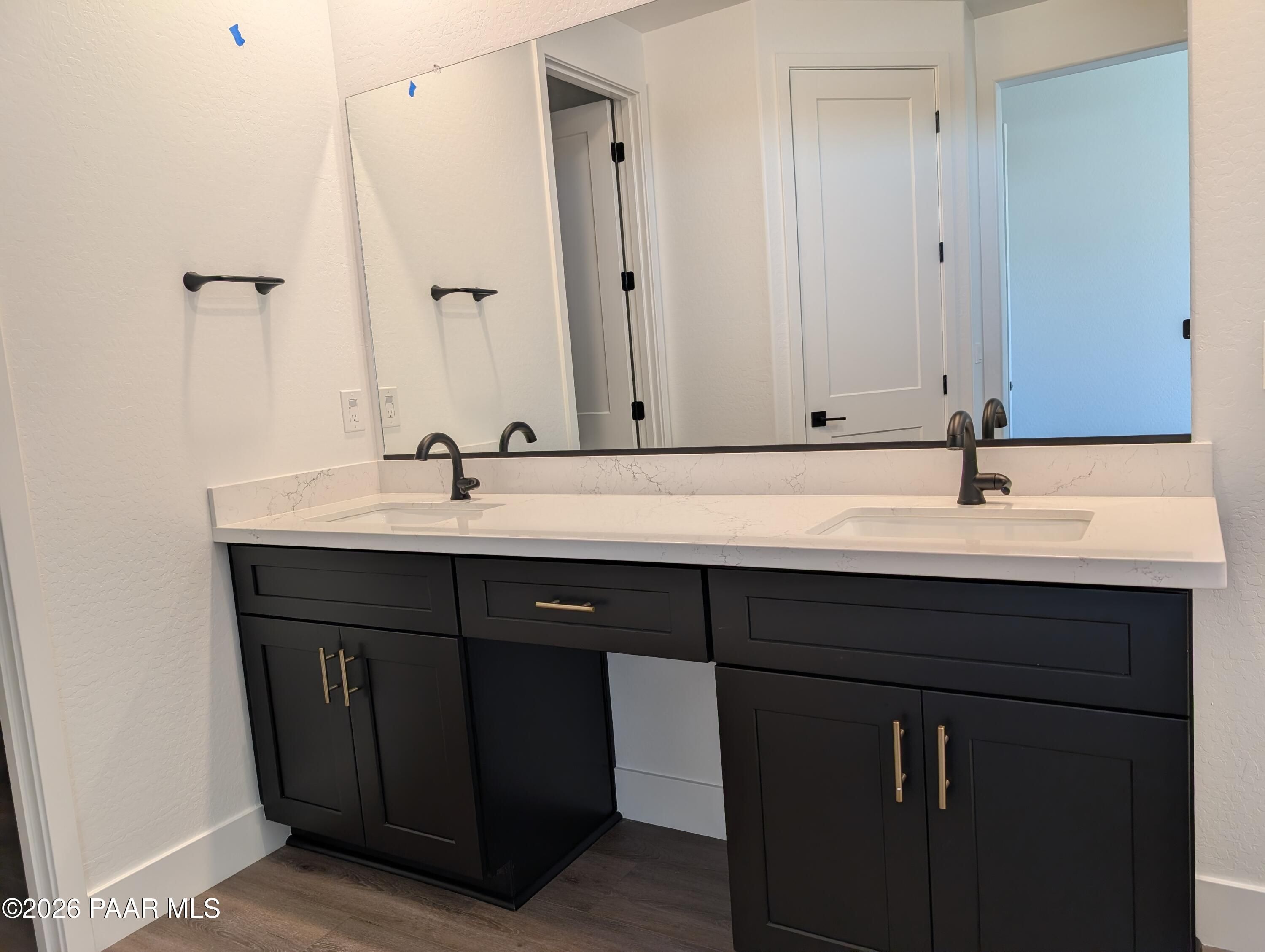 Modern double vanity with quartz counters, dark shaker cabinets, and frameless mirrors in master bath, The Sheridan II G, Prescott AZ