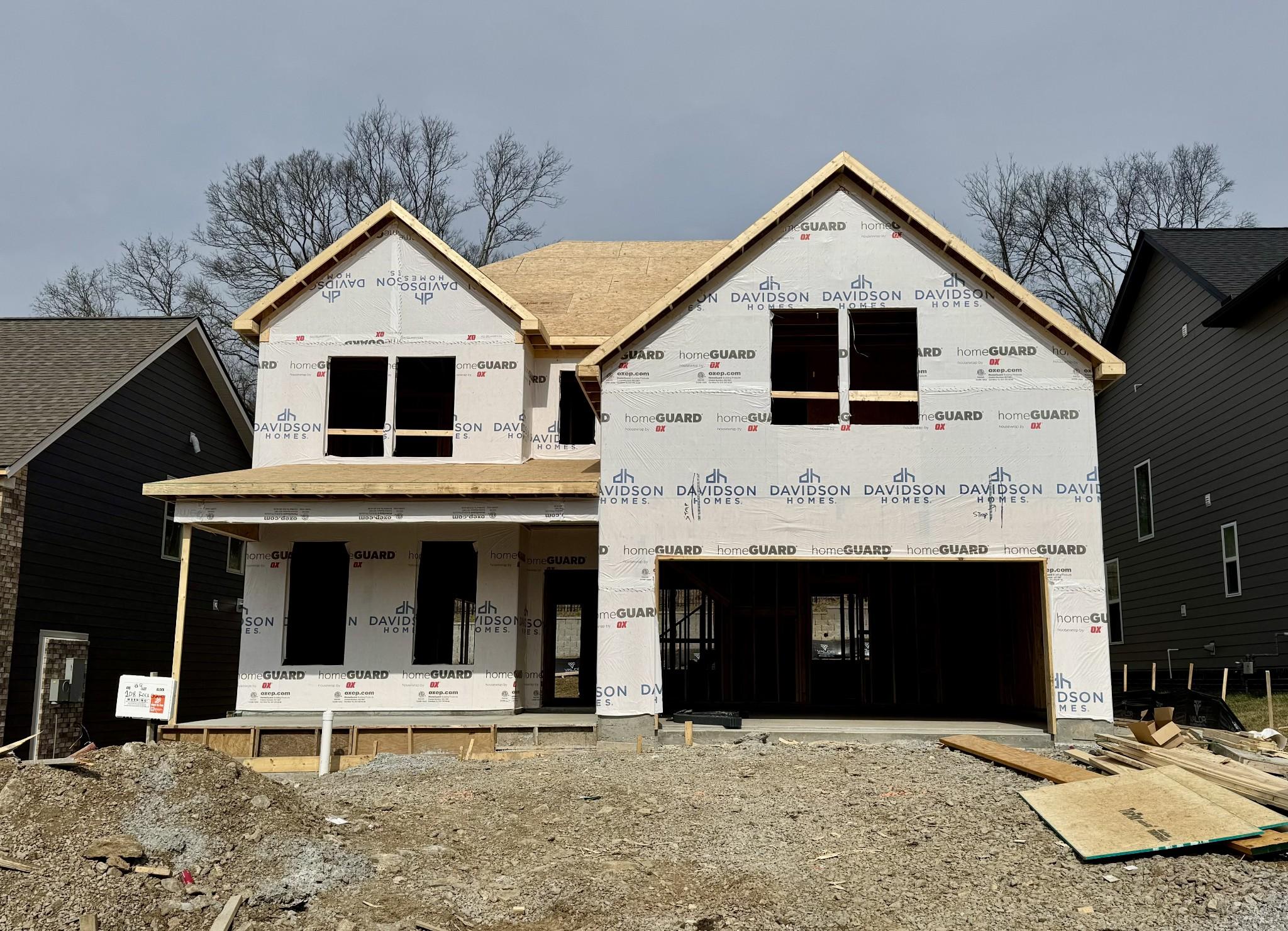 Two-story Willow floor plan home under construction by Davidson Homes in Woods Crossing, Gallatin, Tennessee, with 2-car garage and front porch