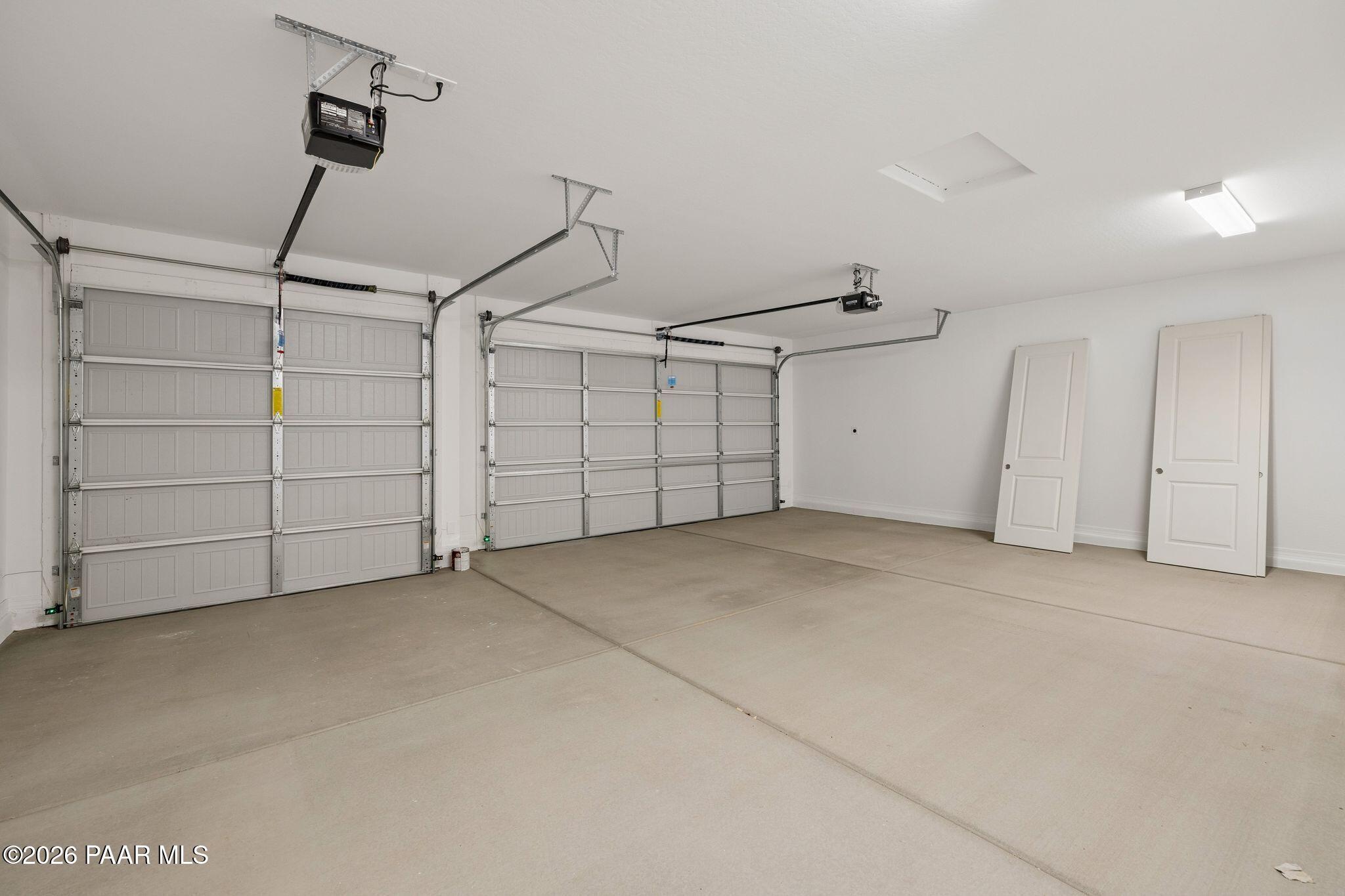 Spacious 3-car garage with overhead doors and interior access in Davidson Homes The Monarch A, Westwood, Prescott, AZ