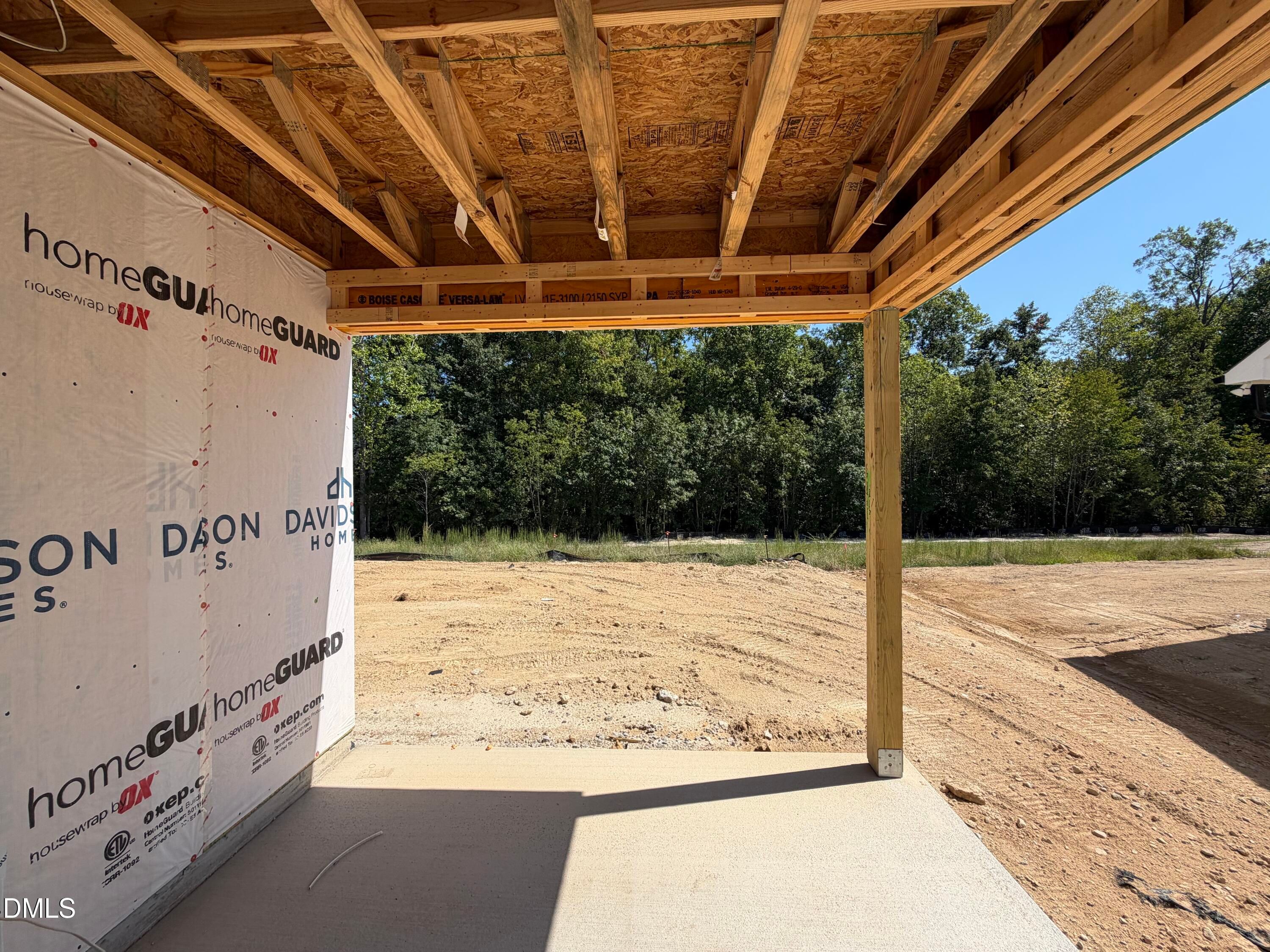 Covered porch under construction with exposed wood framing at Davidson Homes Aspen C in Wendell Ridge, Wendell, North Carolina