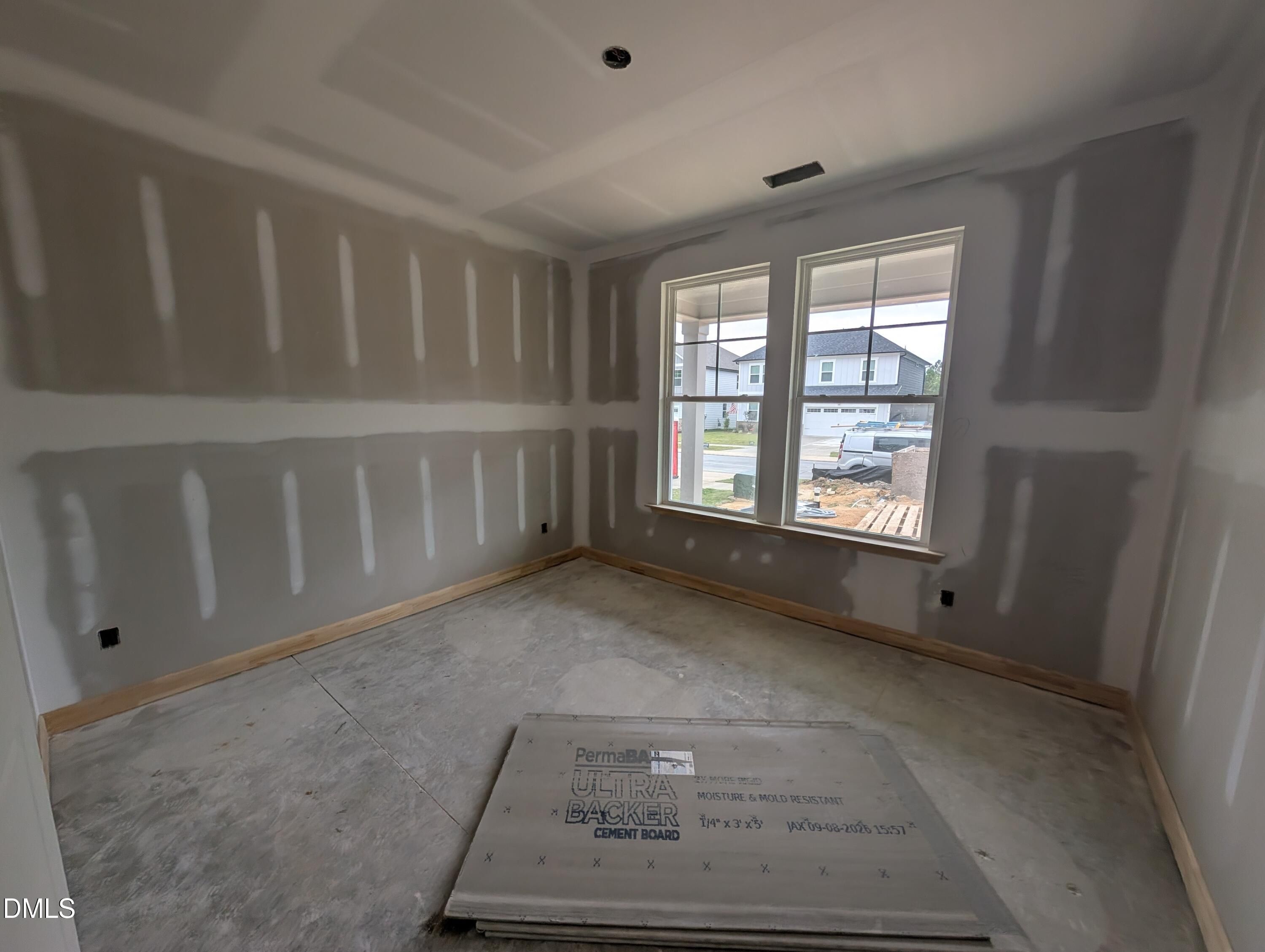 Unfinished room with drywall and double windows under construction in Davidson Homes The Beech floor plan, Wendell Ridge, Wendell NC