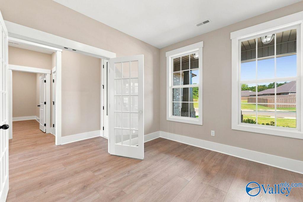 Bright home office or flex room with French doors in The Rockford floor plan by Davidson Homes in Cain Park, Hartselle, AL.