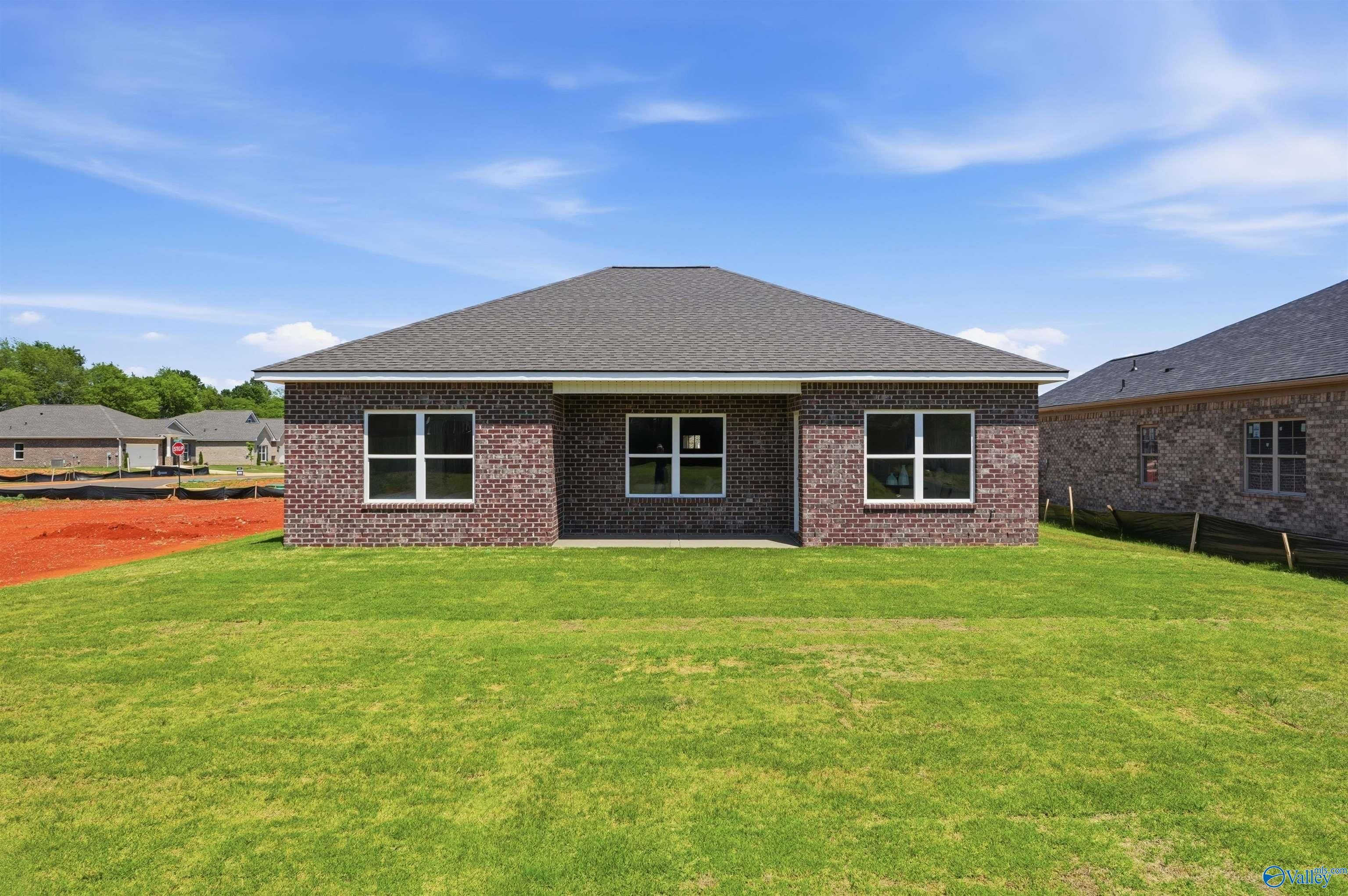 Rear view of The Franklin C floor plan by Davidson Homes in Lynn Meadows, Meridianville, Alabama with a private backyard.