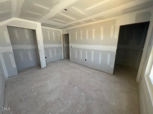 Unfinished bedroom with drywall and vaulted ceiling in Davidson Homes The Ash C plan, Lillington, North Carolina