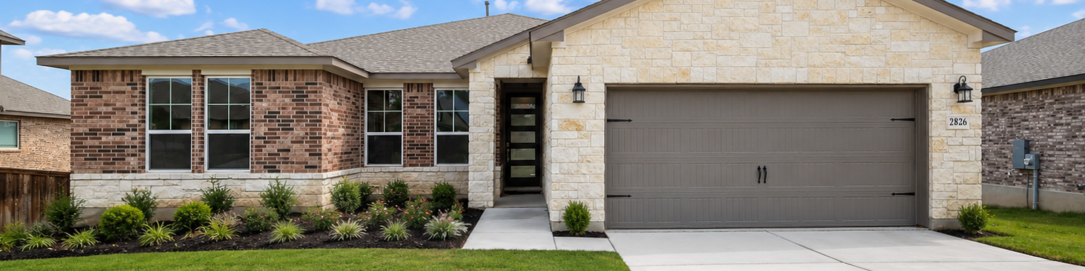 Cozy open-concept living room in Ladera San Antonio TX home with stone fireplace, exposed wood beams, ceiling fan, plush beige sofa and neutral decor