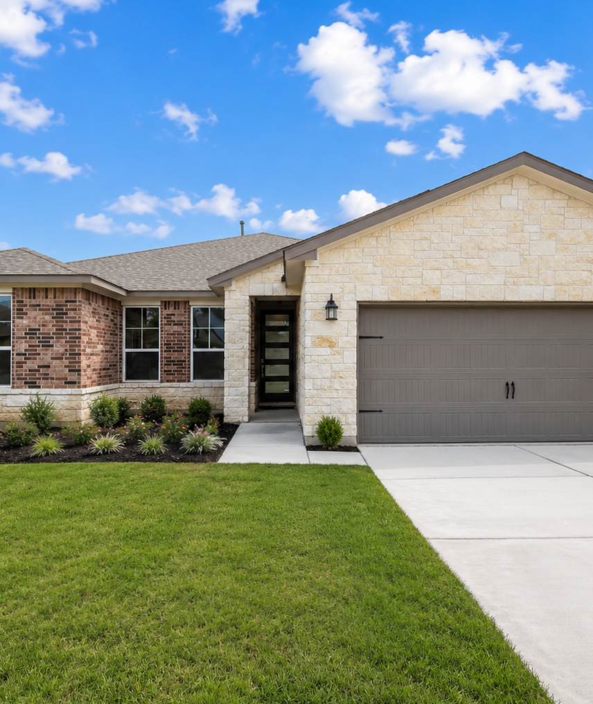 Cozy open-concept living room in Ladera San Antonio TX home with stone fireplace, exposed wood beams, ceiling fan, plush beige sofa and neutral decor