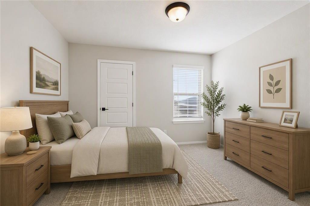 Bright neutral bedroom with wood furniture in The Charlotte B floor plan by Davidson Homes, Greene Farm, Cartersville, Georgia