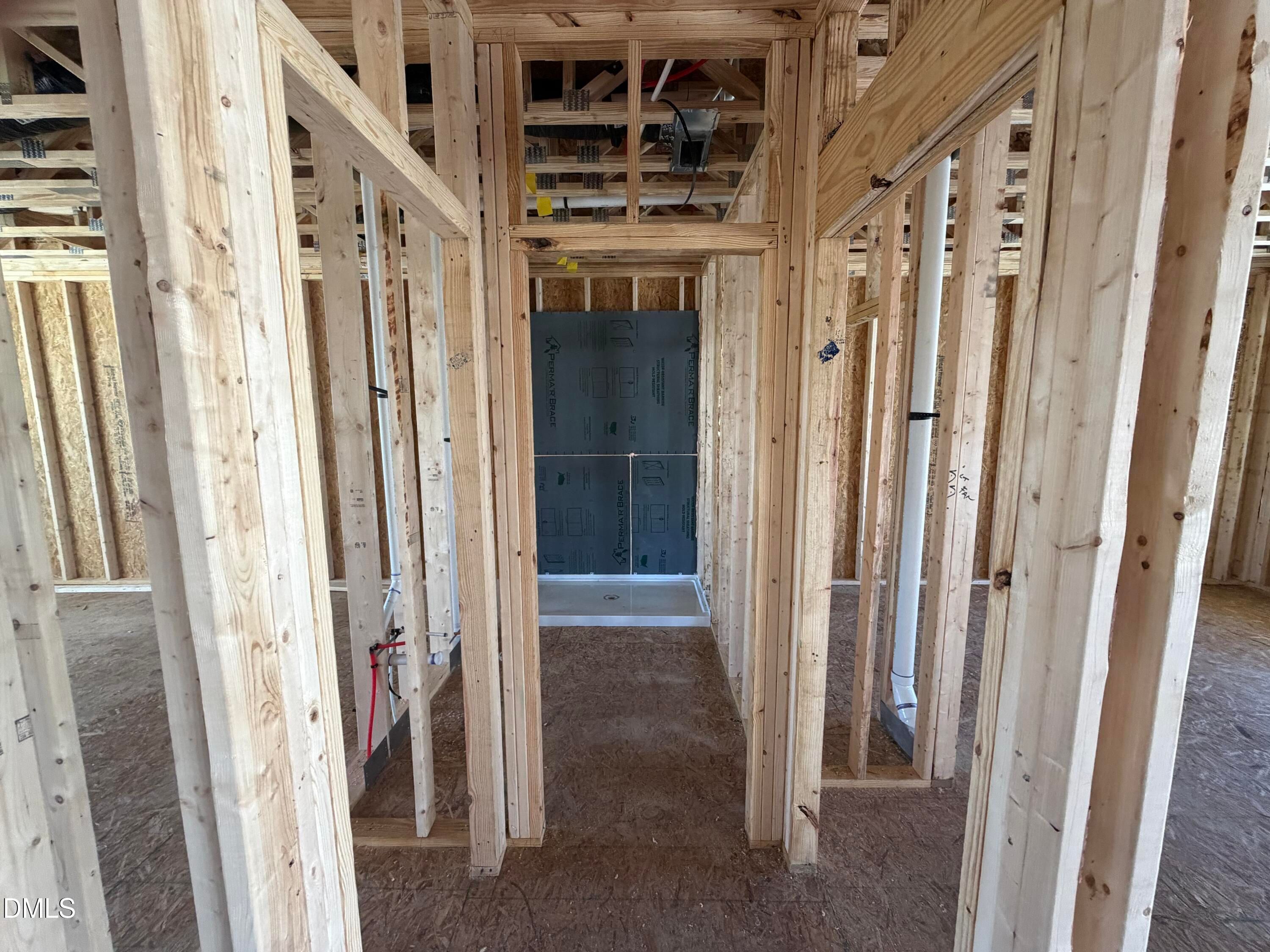 Framed bathroom interior with shower enclosure in Davidson Homes Hickory II B, 5-bedroom Wellers Knoll home, Lillington NC
