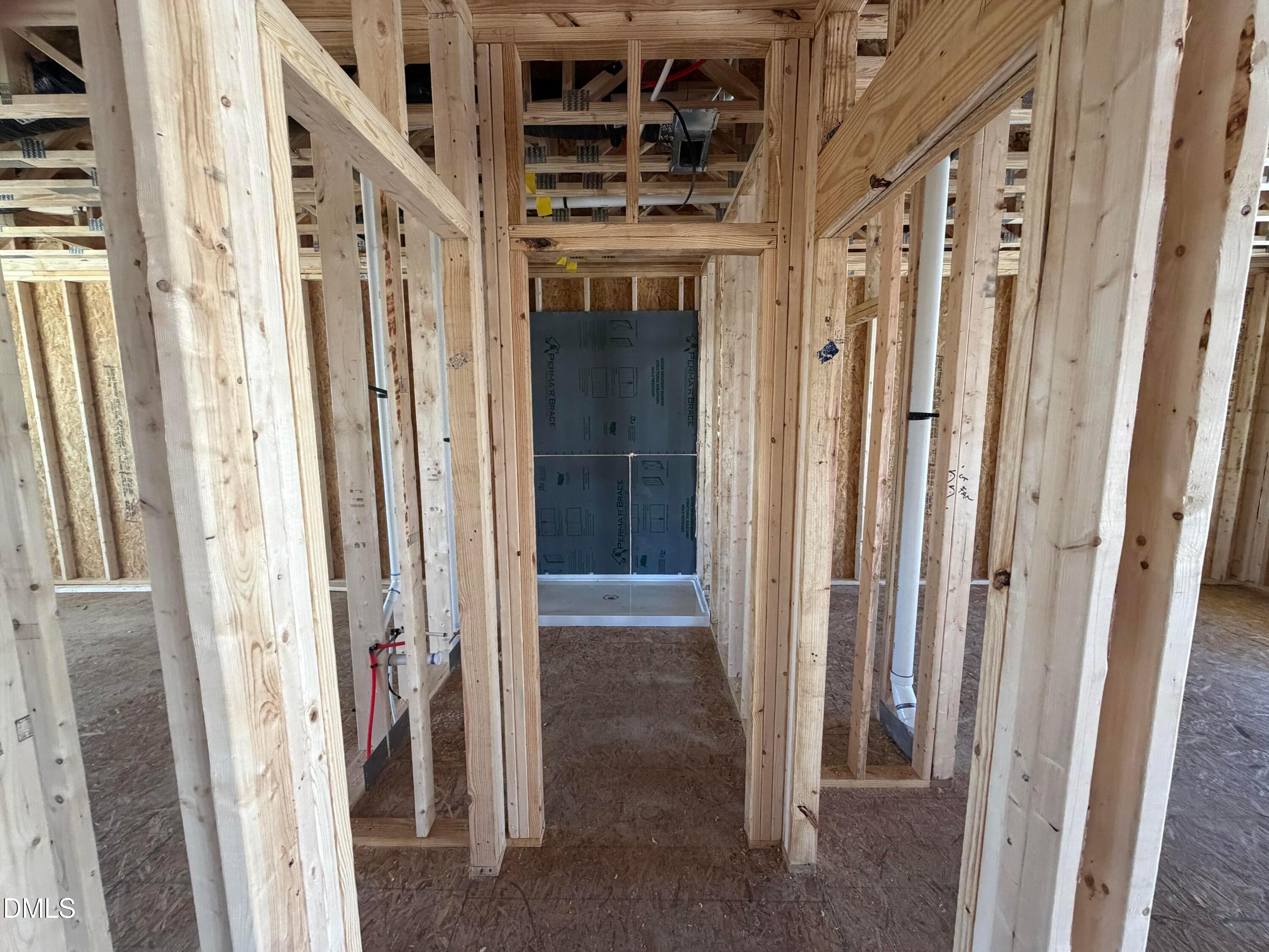 Framed bathroom interior with shower enclosure in Davidson Homes Hickory II B, 5-bedroom Wellers Knoll home, Lillington NC