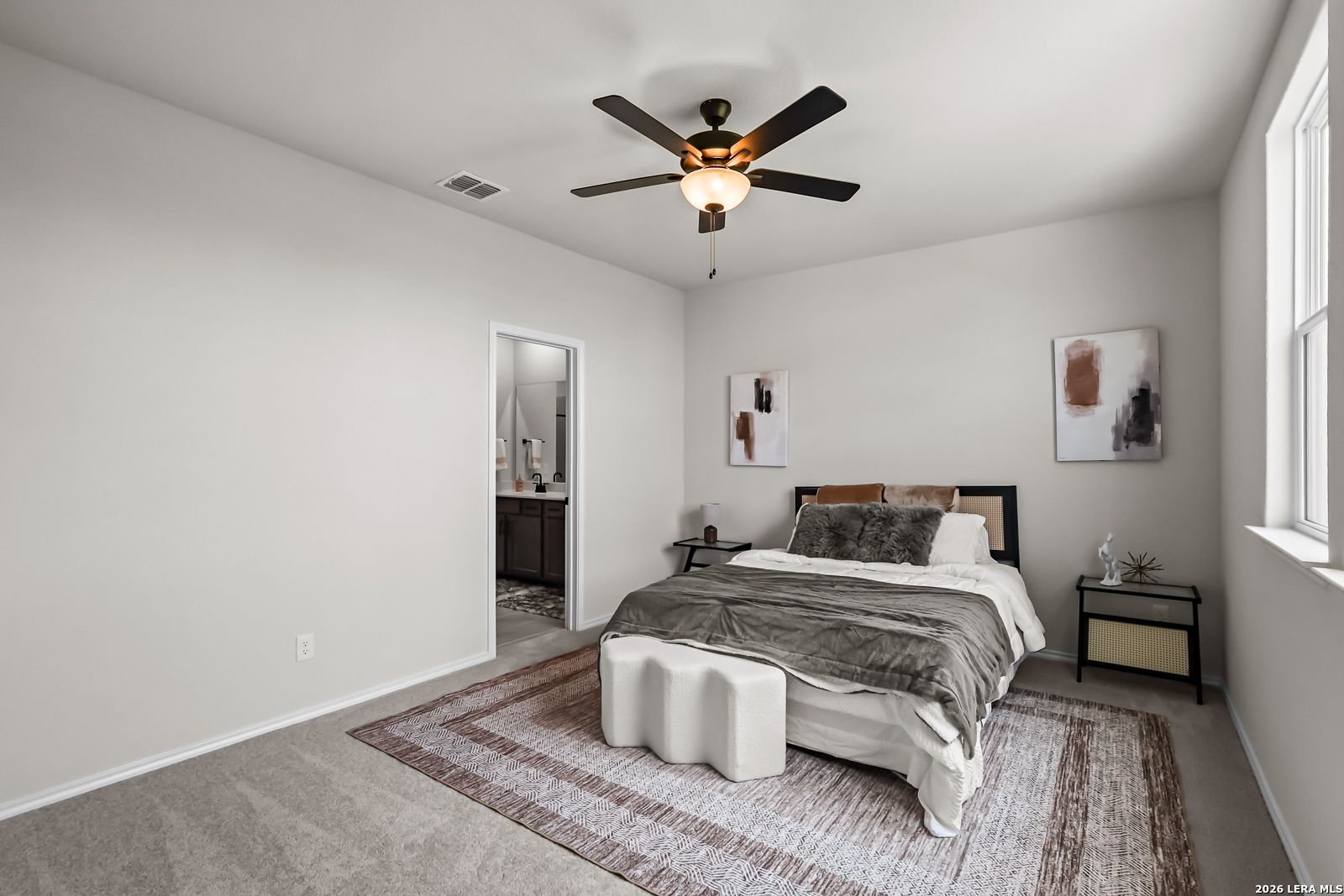 Spacious bedroom with en-suite bath in The Douglas C floor plan by Davidson Homes at Hannah Heights in Seguin, Texas.