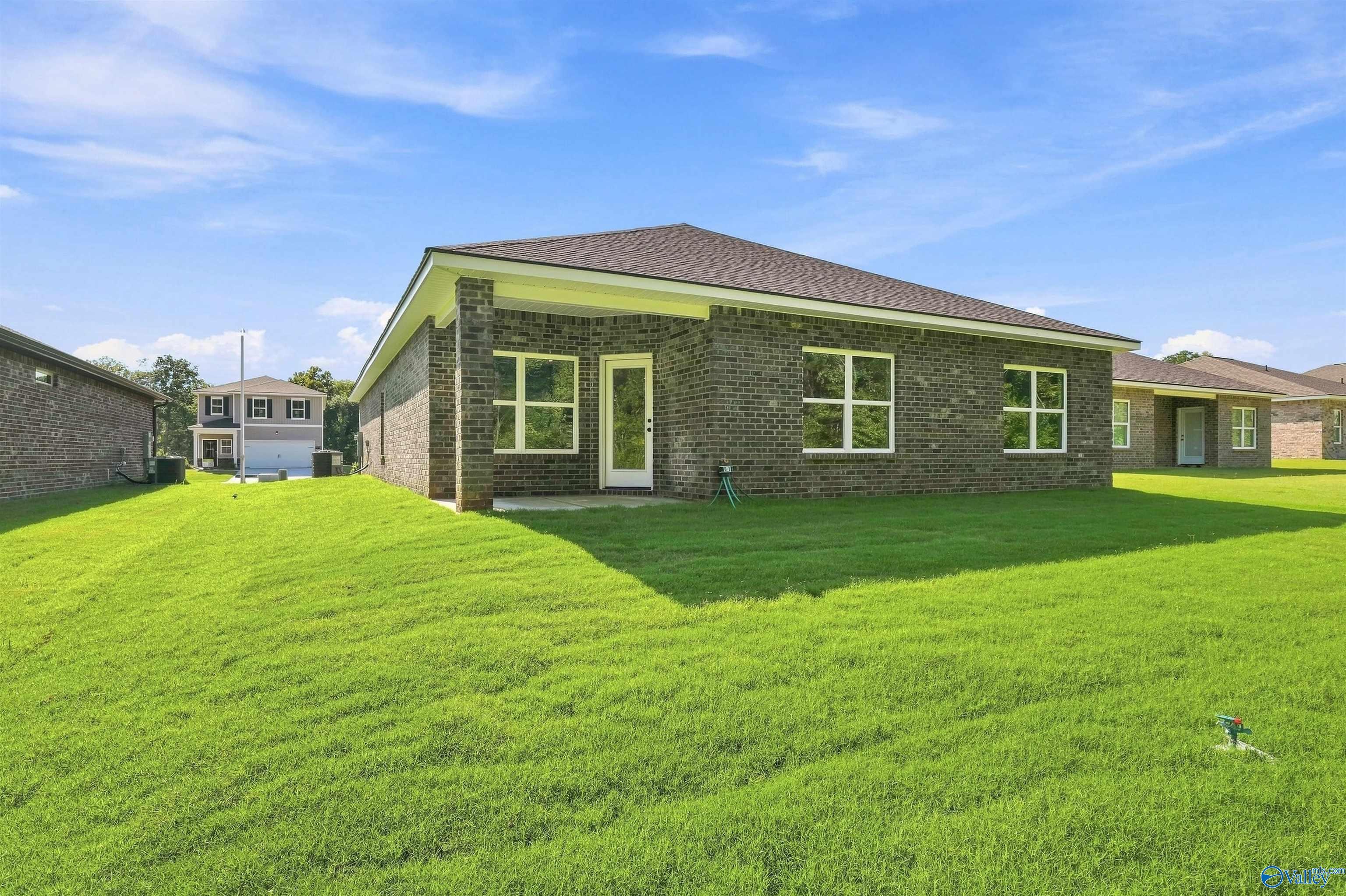Back exterior view of The Daphne floor plan by Davidson Homes in Spragins Cove, Huntsville, Alabama.