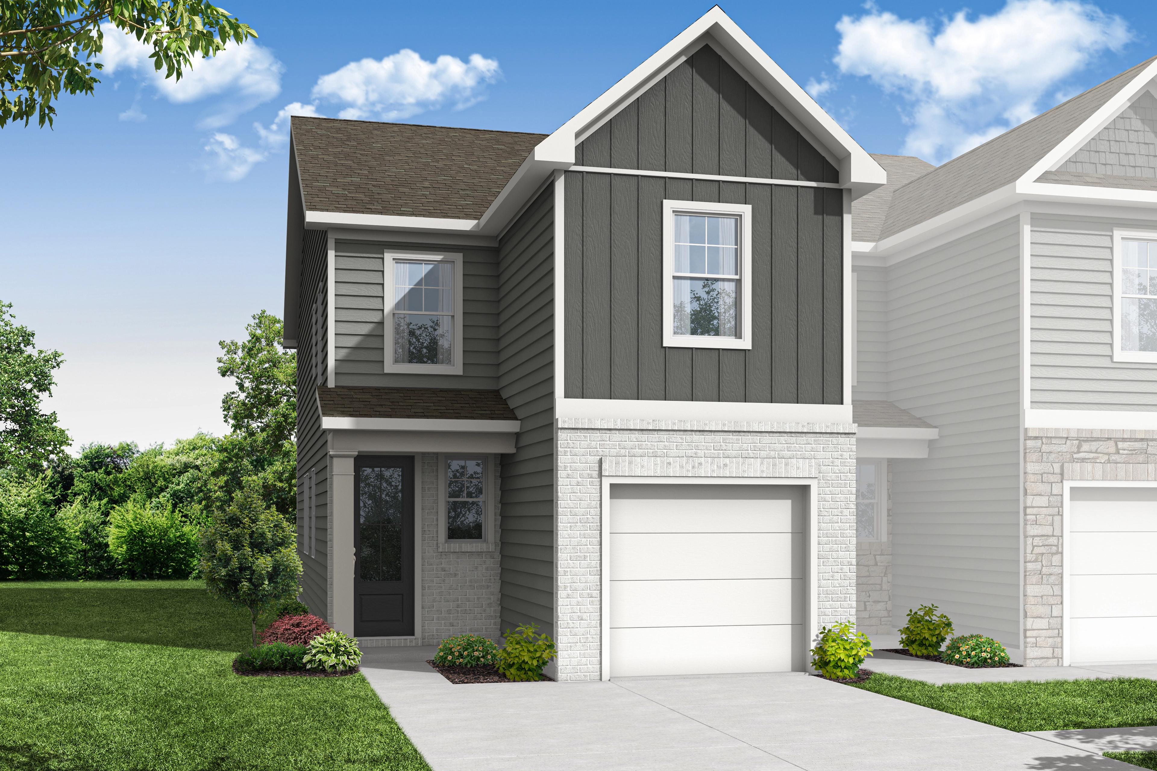 Two-story Wilmington A multi-family home exterior featuring gray siding, white trim, one-car garage, and landscaped yard in Emerson, GA