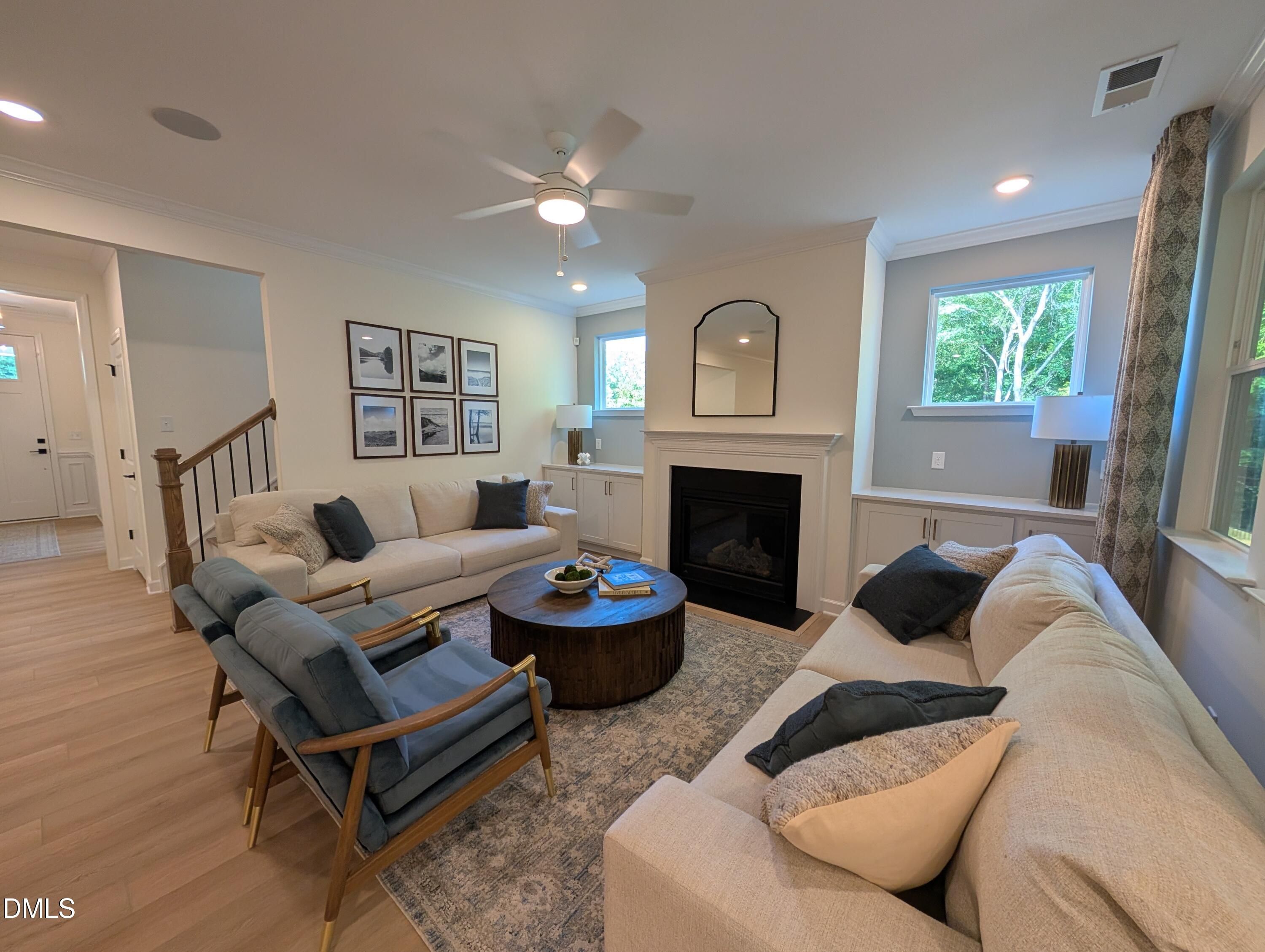 Spacious living room with fireplace and built-ins in The Aspen B floor plan at Wendell Ridge, Wendell, North Carolina.