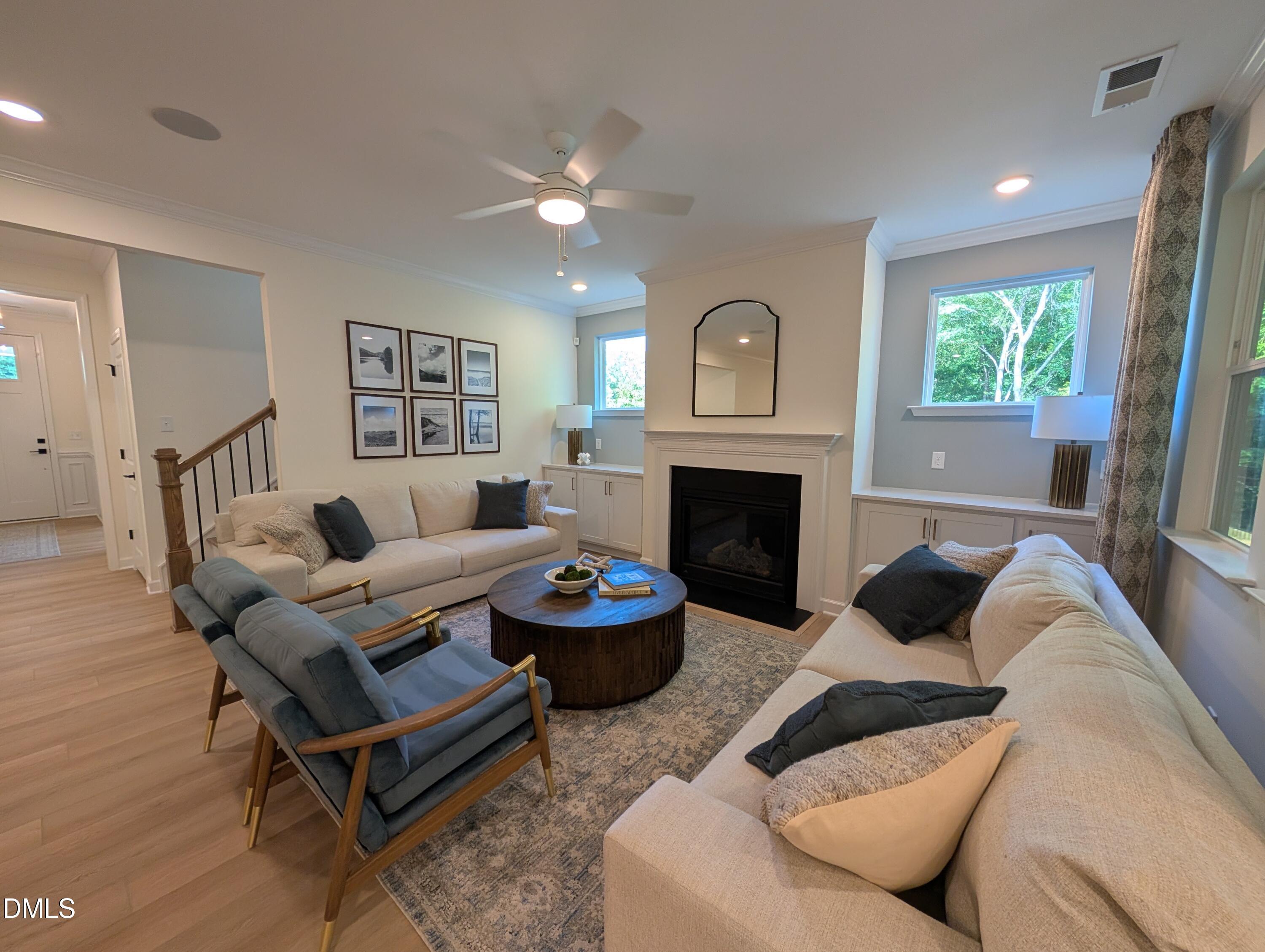 Spacious living room with fireplace and built-ins in The Aspen B floor plan at Wendell Ridge, Wendell, North Carolina.